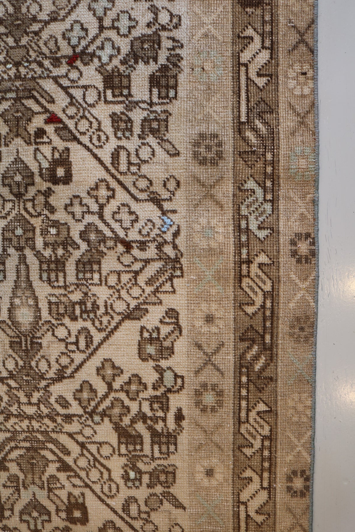 Detailed side section featuring geometric motifs and narrow layered borders