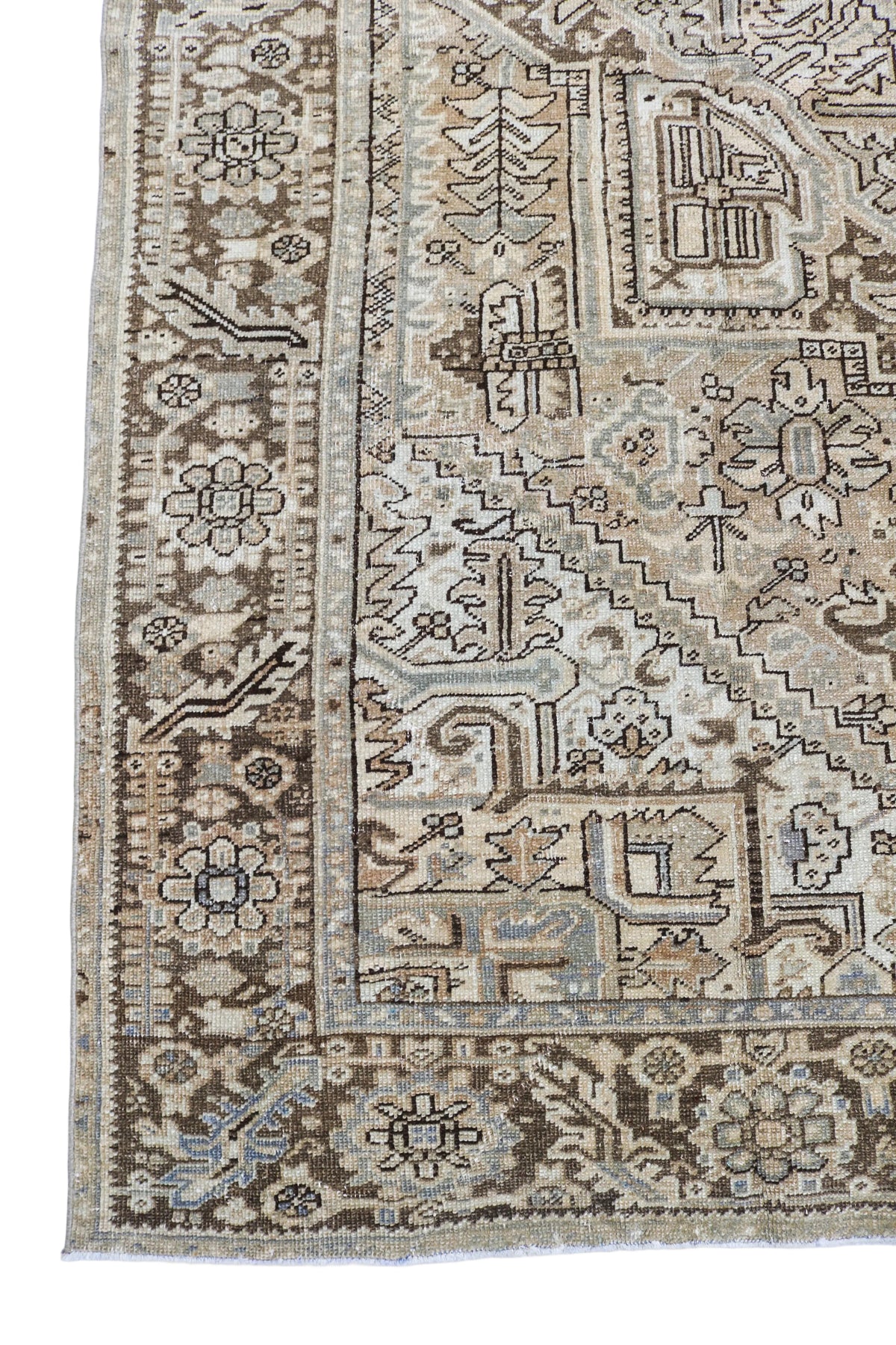 Antique Persian Heriz carpet with geometric medallion and intricate tribal motifs