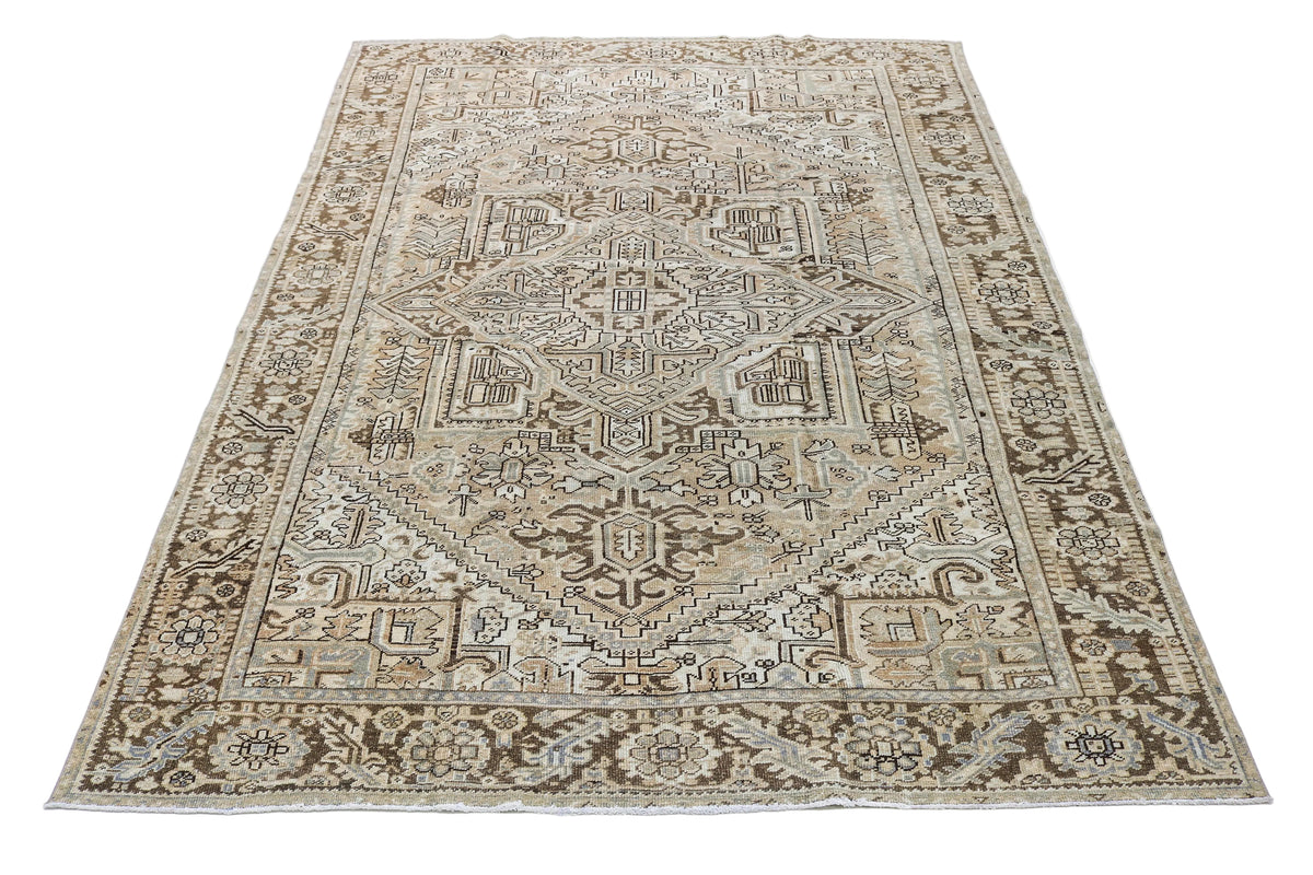 Full view of antique Persian Heriz carpet with balanced geometric composition