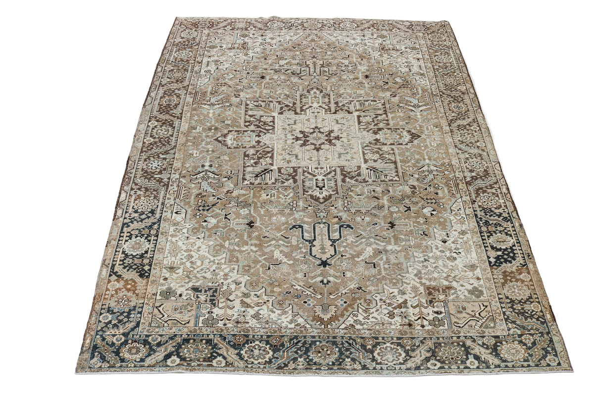 Full view of antique Persian Heriz carpet with traditional geometric medallion design