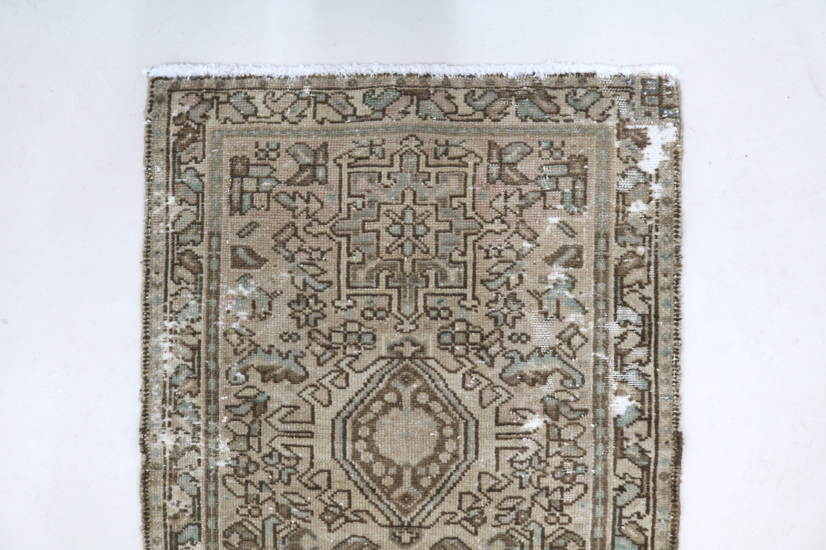 Close view of runner corner with dense geometric and floral-inspired motifs
