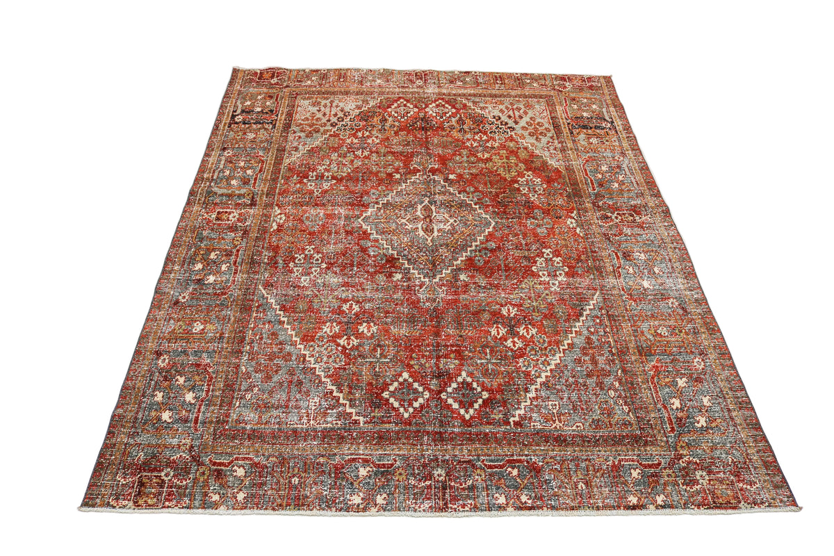 Full view of antique Persian Josheqan rug with central geometric medallion and detailed borders