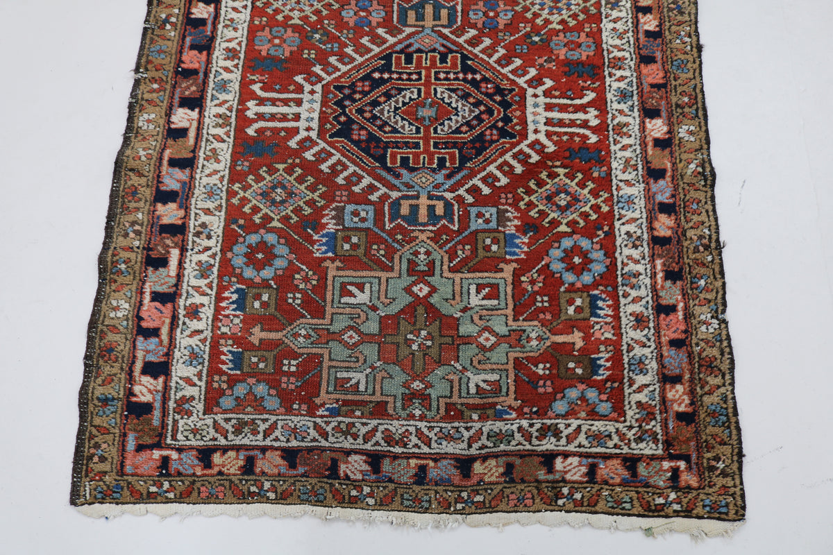Detailed Karaja rug field with blue, rust and camel geometric motifs