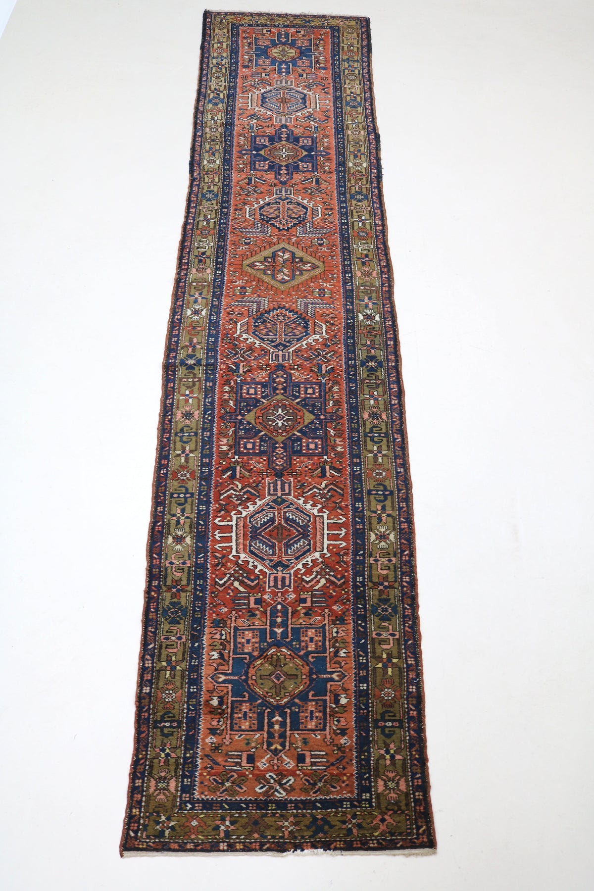 Full Karaja runner showing elongated single-column design with repeating geometric medallions