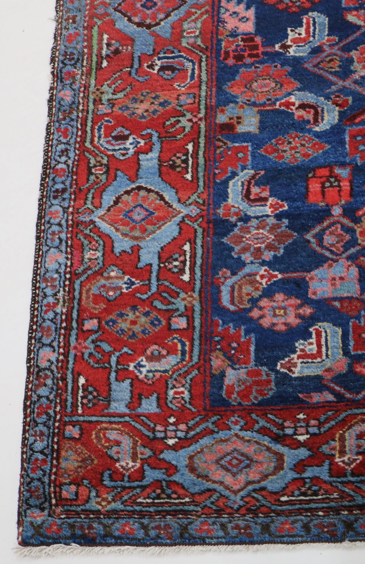 Antique Persian Malayer runner with deep blue field, rust accents and intricate Herati motifs
