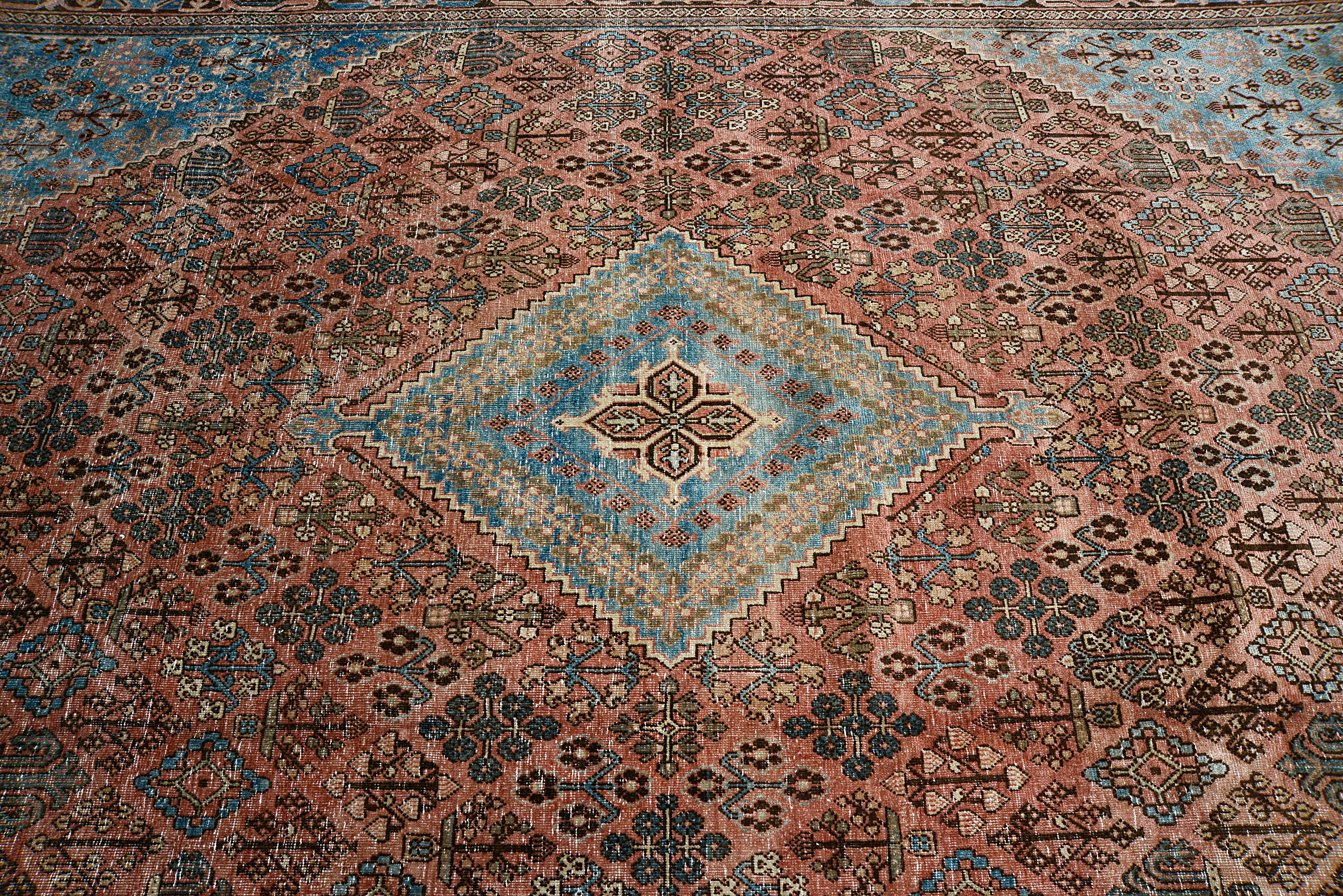 Close-up of diamond lattice medallion on antique Persian Josheqan rug