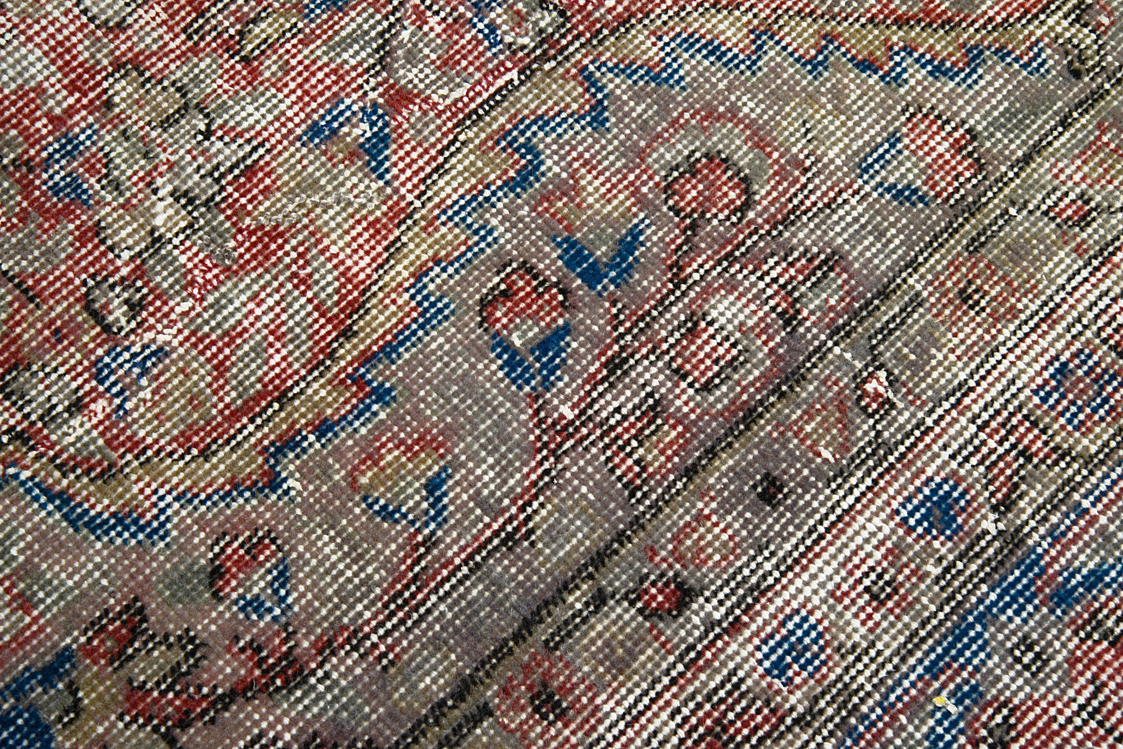 Close-up of corner detail on vintage Turkish carpet