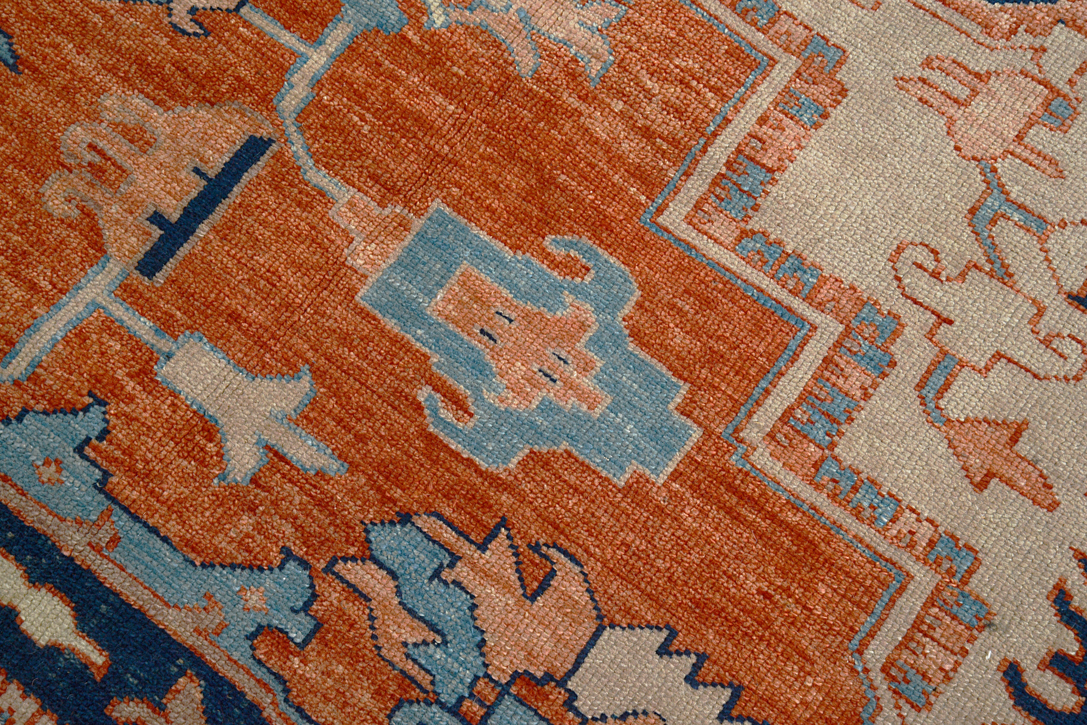Close-up of geometric field motifs on Persian Heriz Serapi carpet