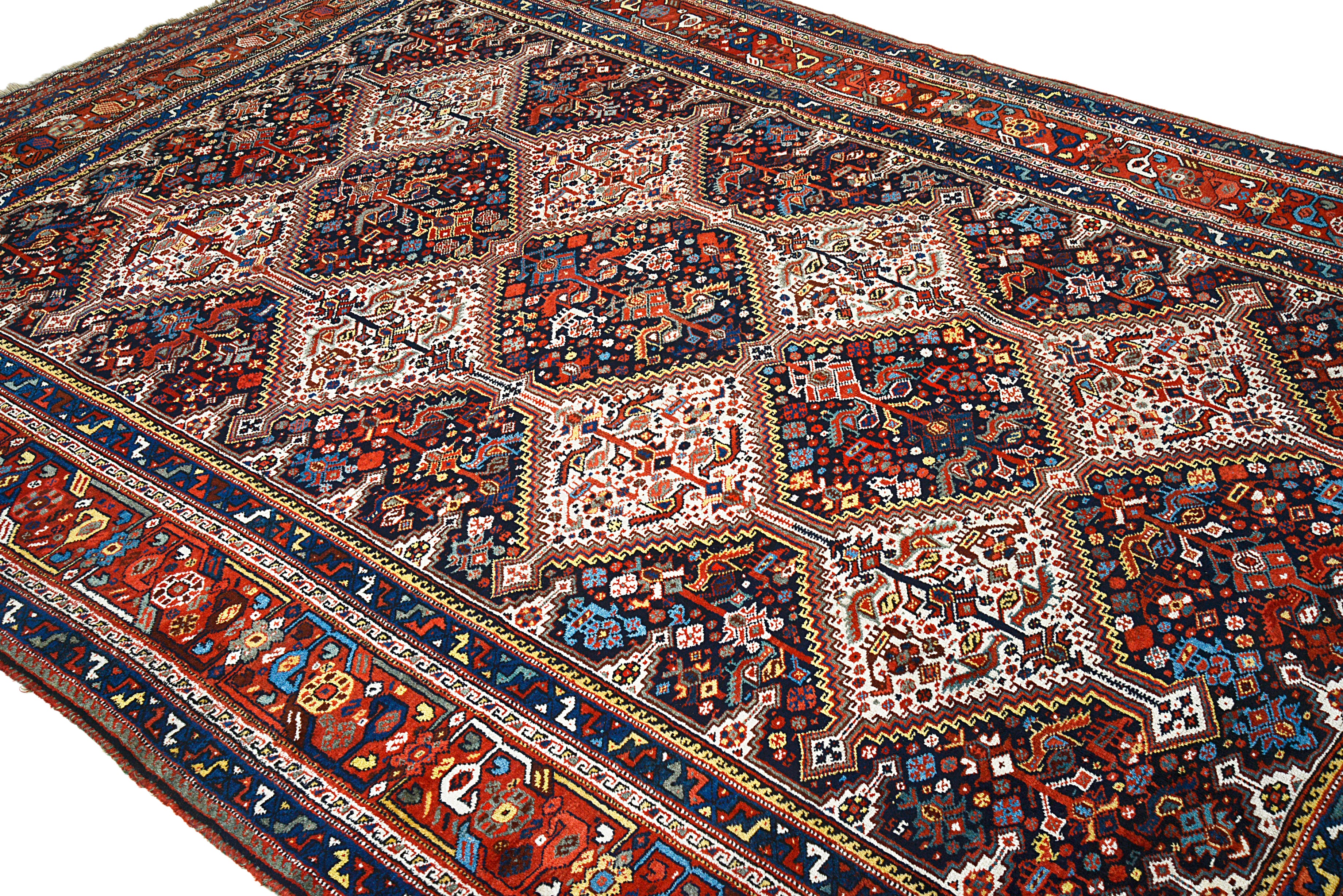 Secondary full view of an antique Persian Qashqai carpet showing balanced tribal design