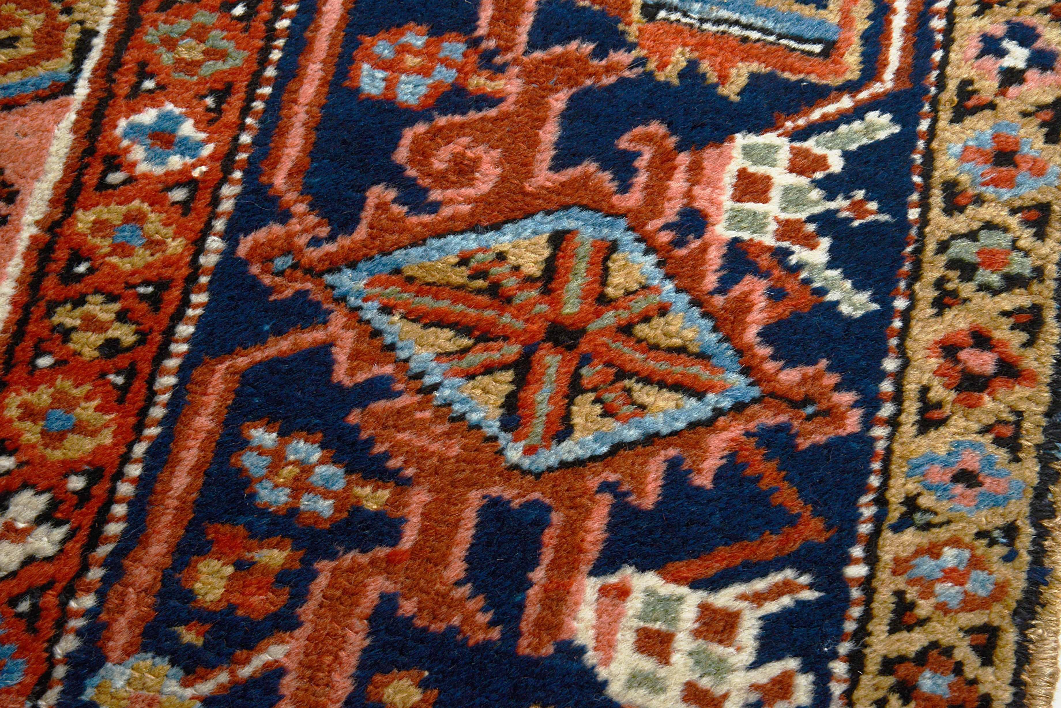 Detail of the guard borders on an antique Persian Heriz carpet
