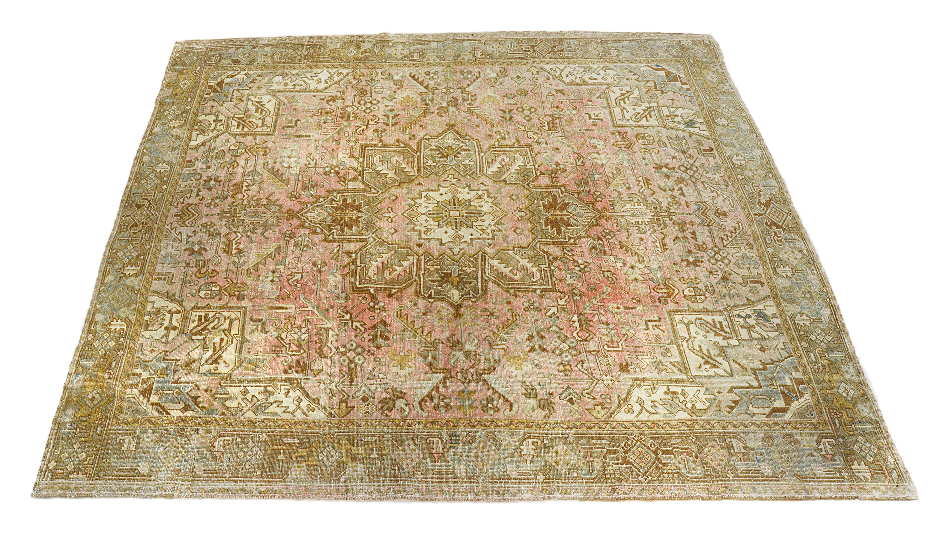 Large vintage Heriz rug from northwest Persia with bold tribal medallion and wide border, hand-knotted wool carpet, 1940s