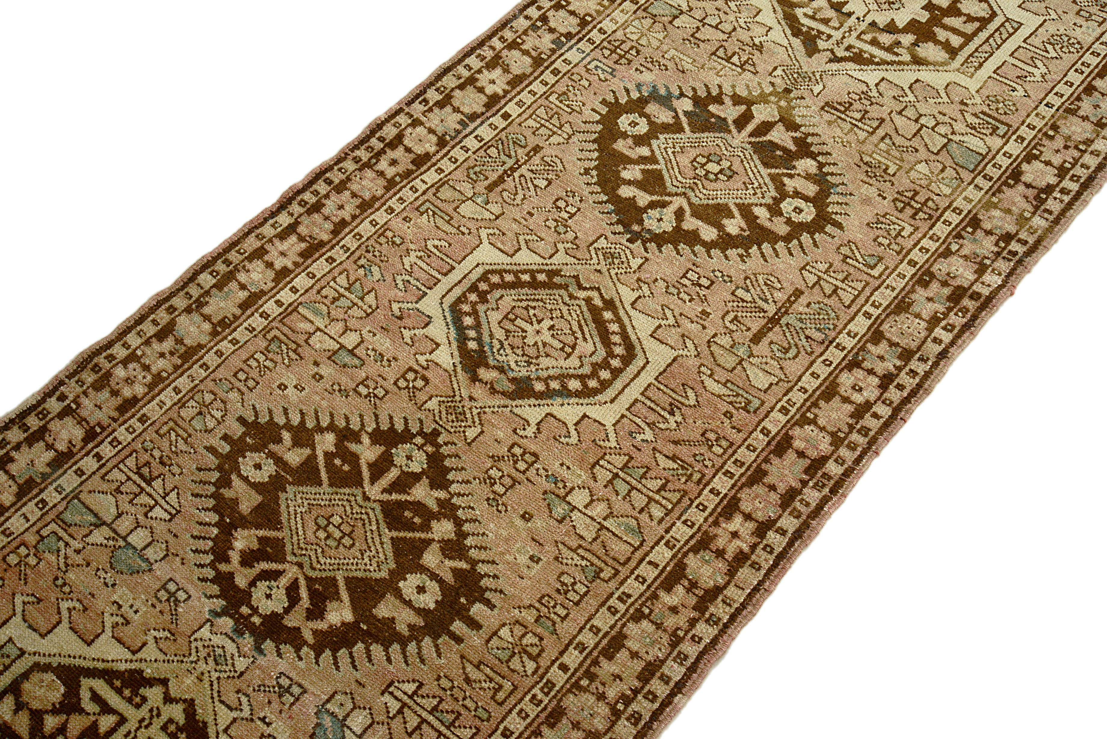 Close-up of a patterned handmade Persian Heriz Runner with geometric designs on a white background