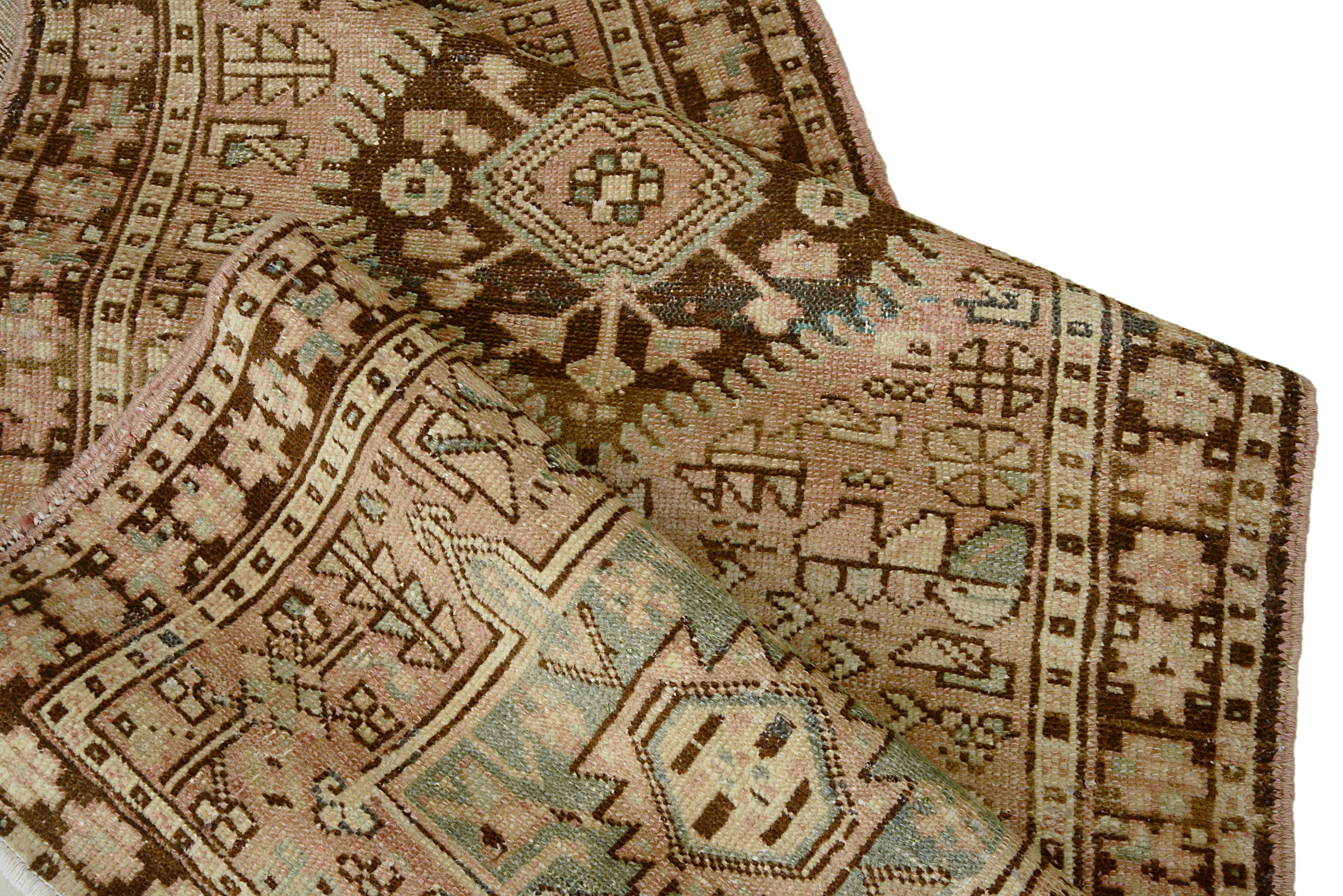Hand-knotted wool texture of an antique Persian Heriz runner