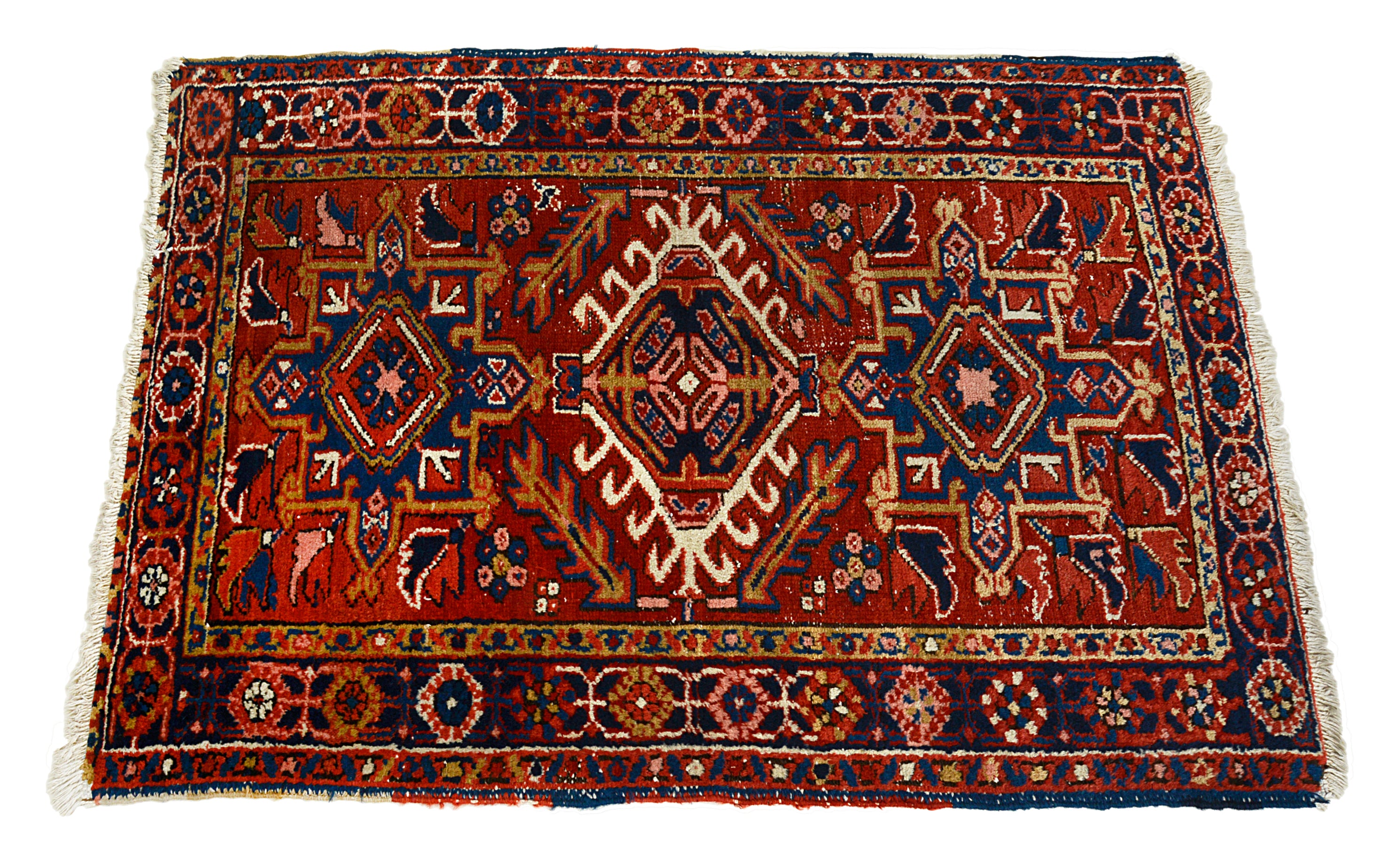Decorative Persian Heriz rug with intricate patterns on a white background