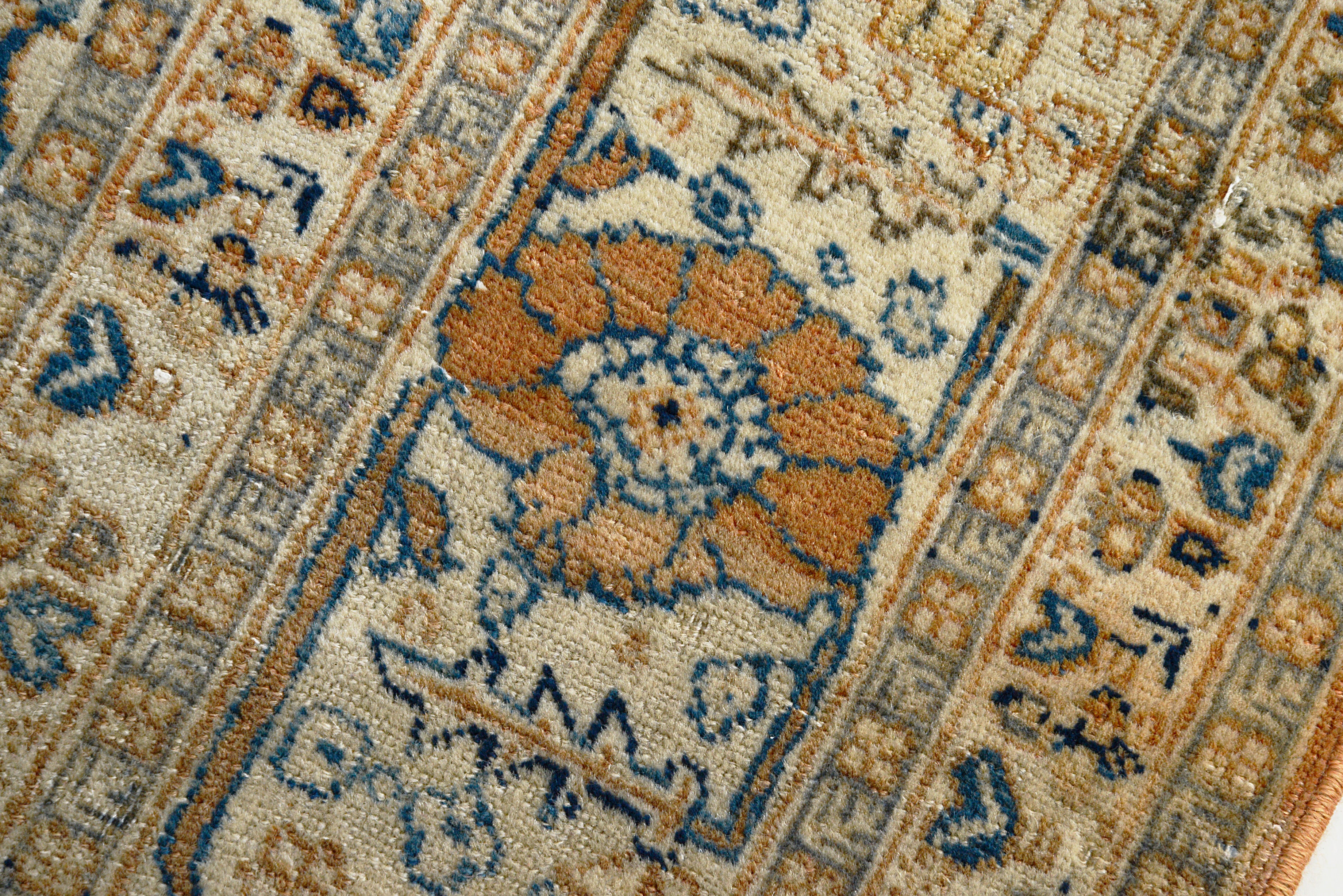 Close-up of an intricately Tabriz rug with floral design