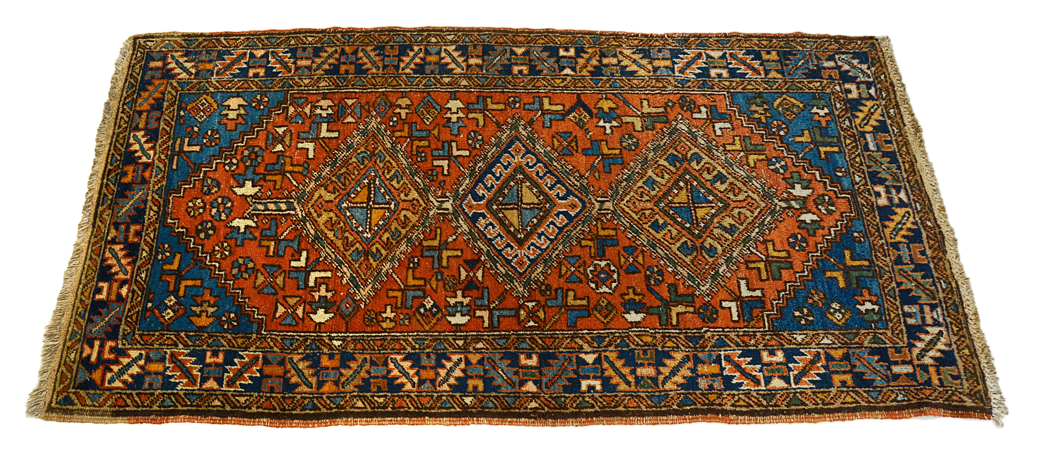 Decorative Heriz rug with geometric pattern on a white background