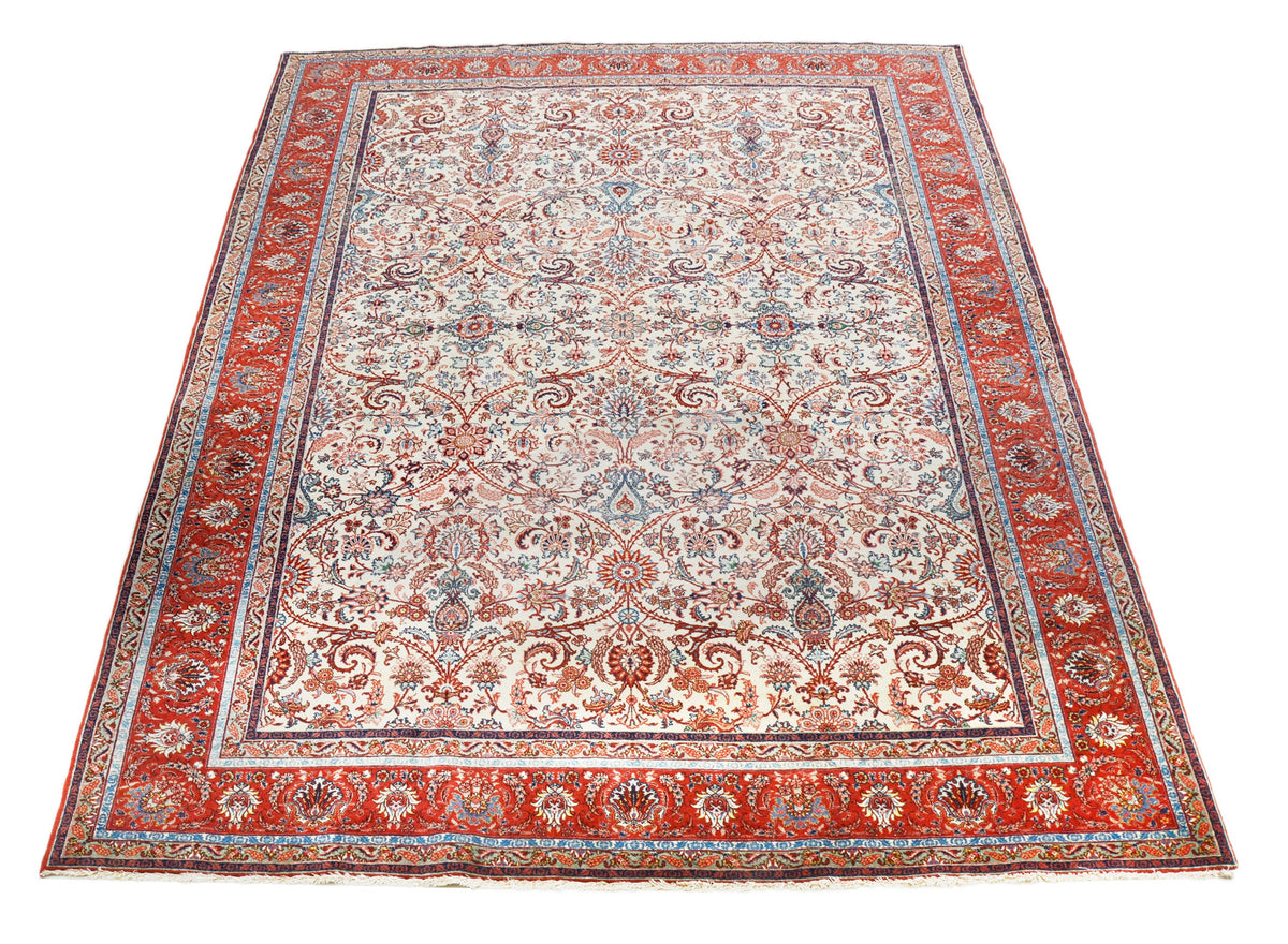 Full view of antique Persian Tabriz rug with all-over floral design and patterned borders