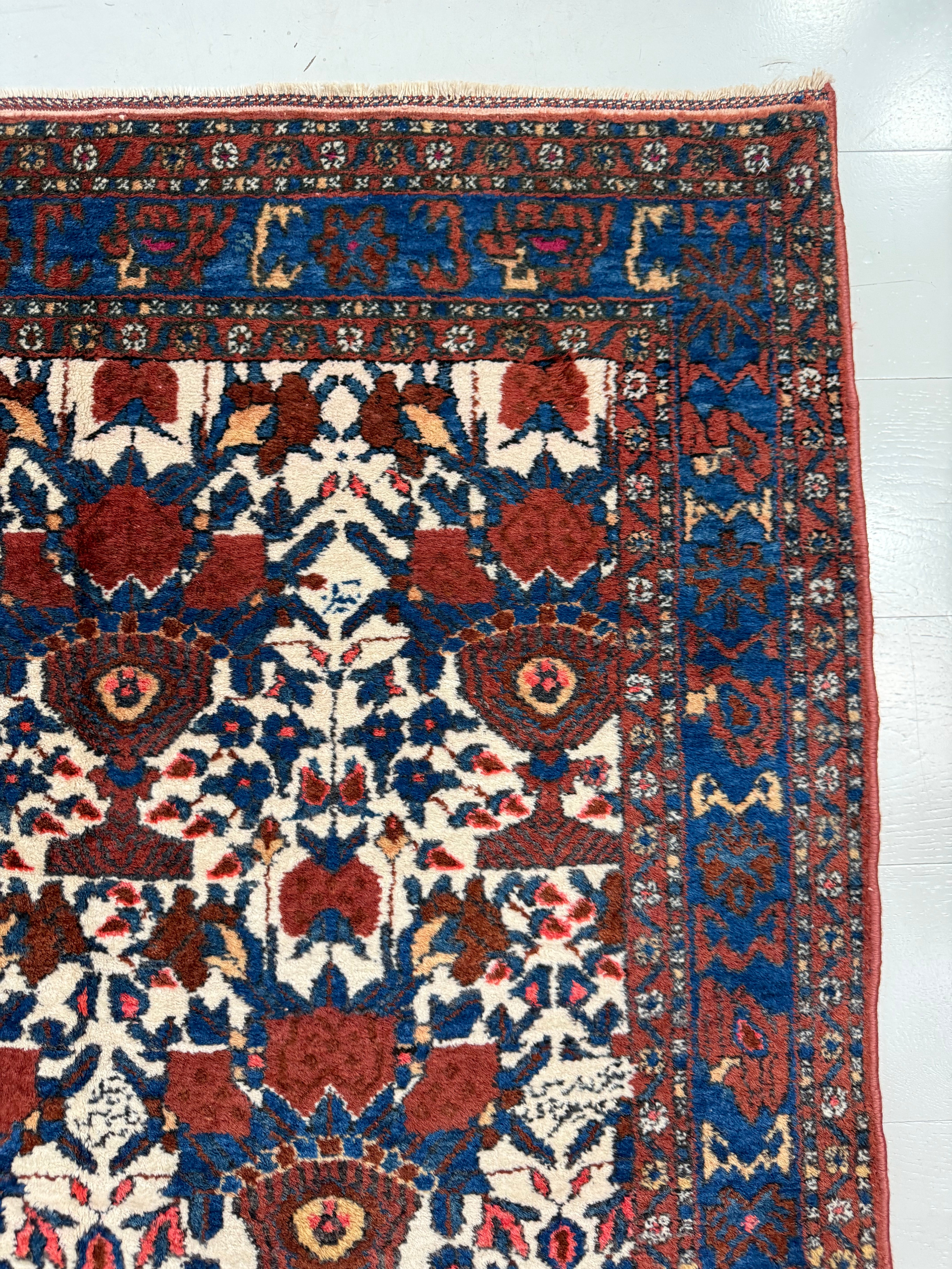 Close-up of repeating geometric field motifs on antique Persian Afshar rug