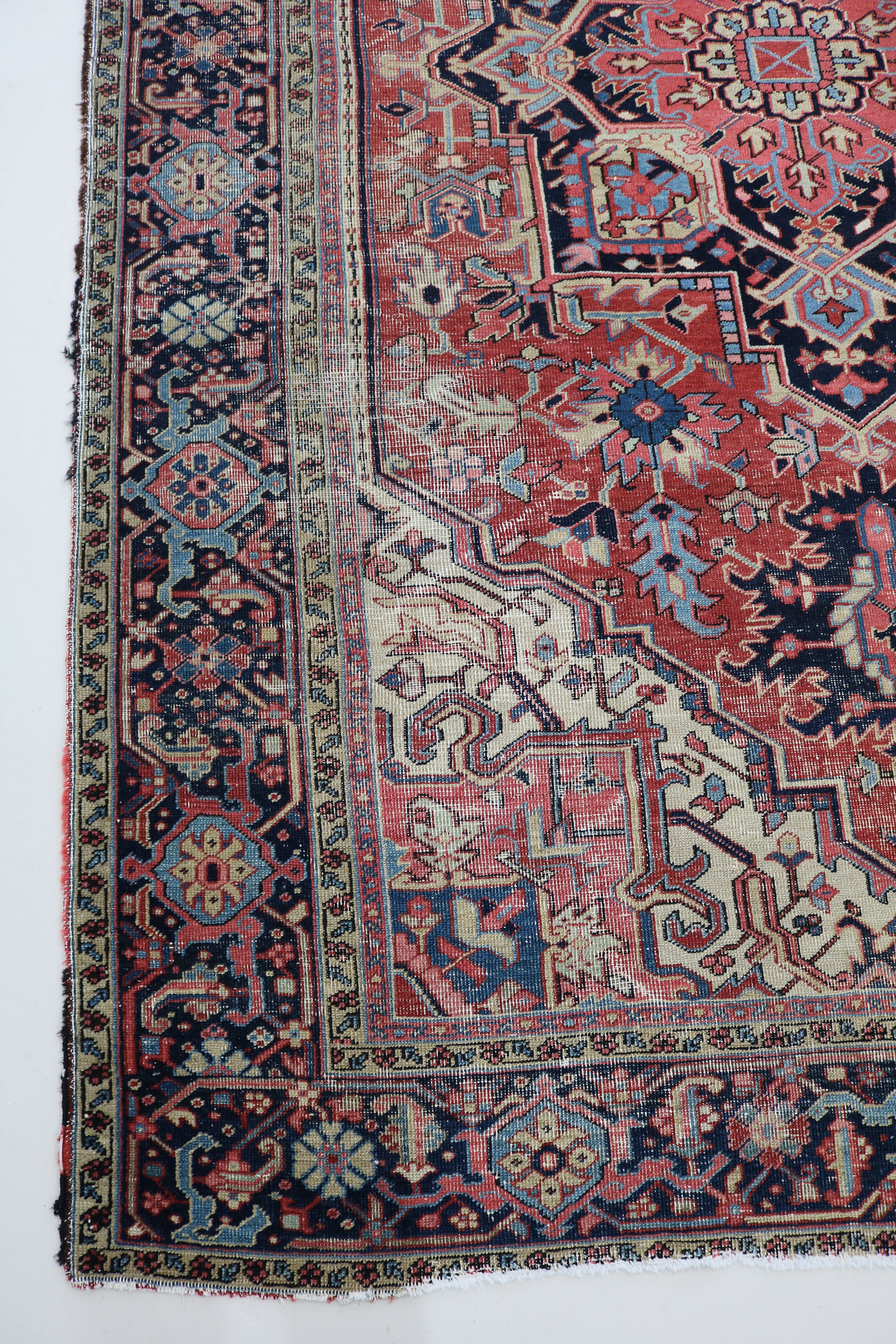 Long view of fine antique Persian Heriz carpet showing refined proportions and bold geometric design, 341 × 211 cm