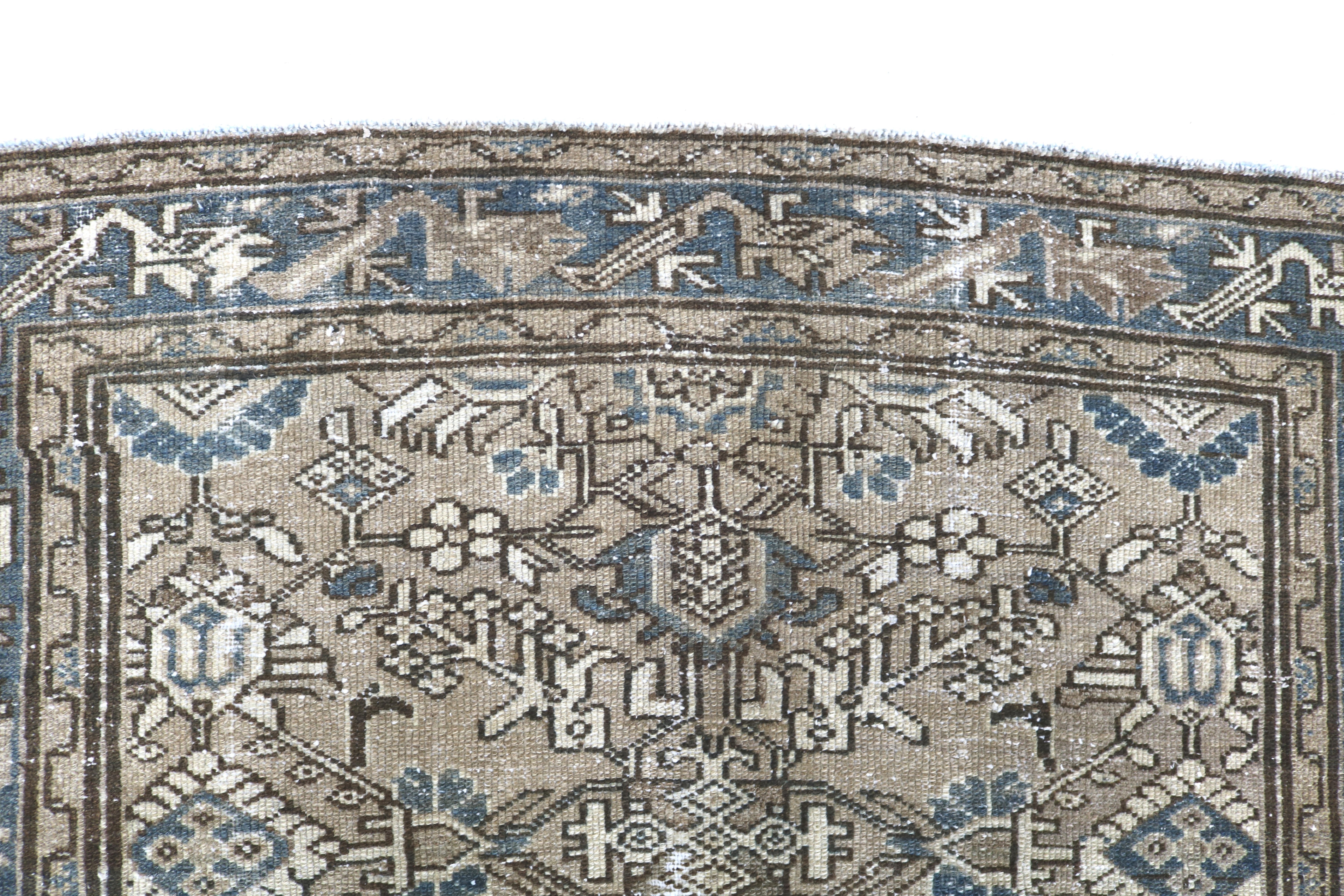 Close-up of hand-knotted wool texture on antique Persian Karaja rug