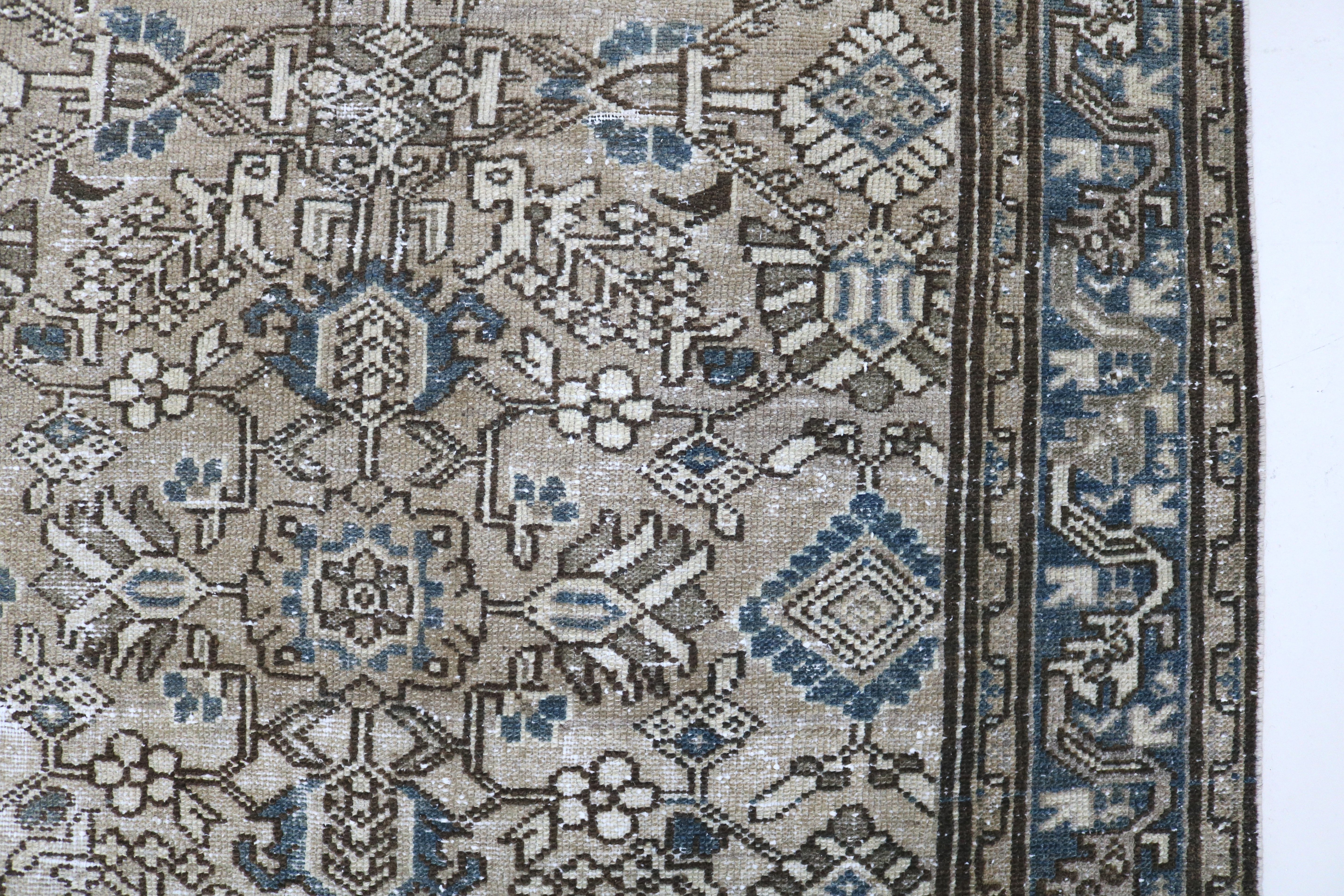 Close-up of hand-knotted wool texture on antique Persian Karaja rug