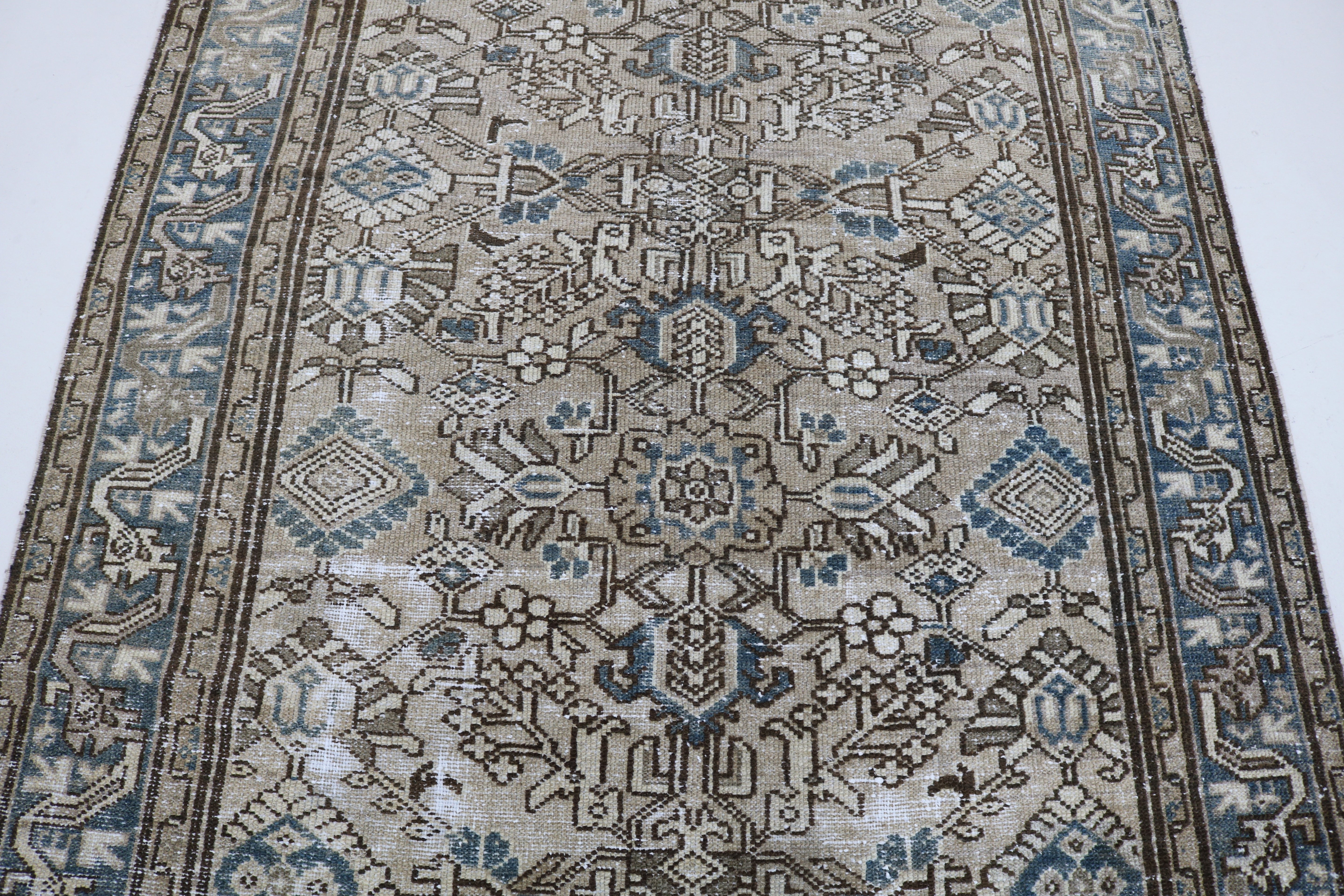 Close-up of hand-knotted wool texture on antique Persian Karaja rug
