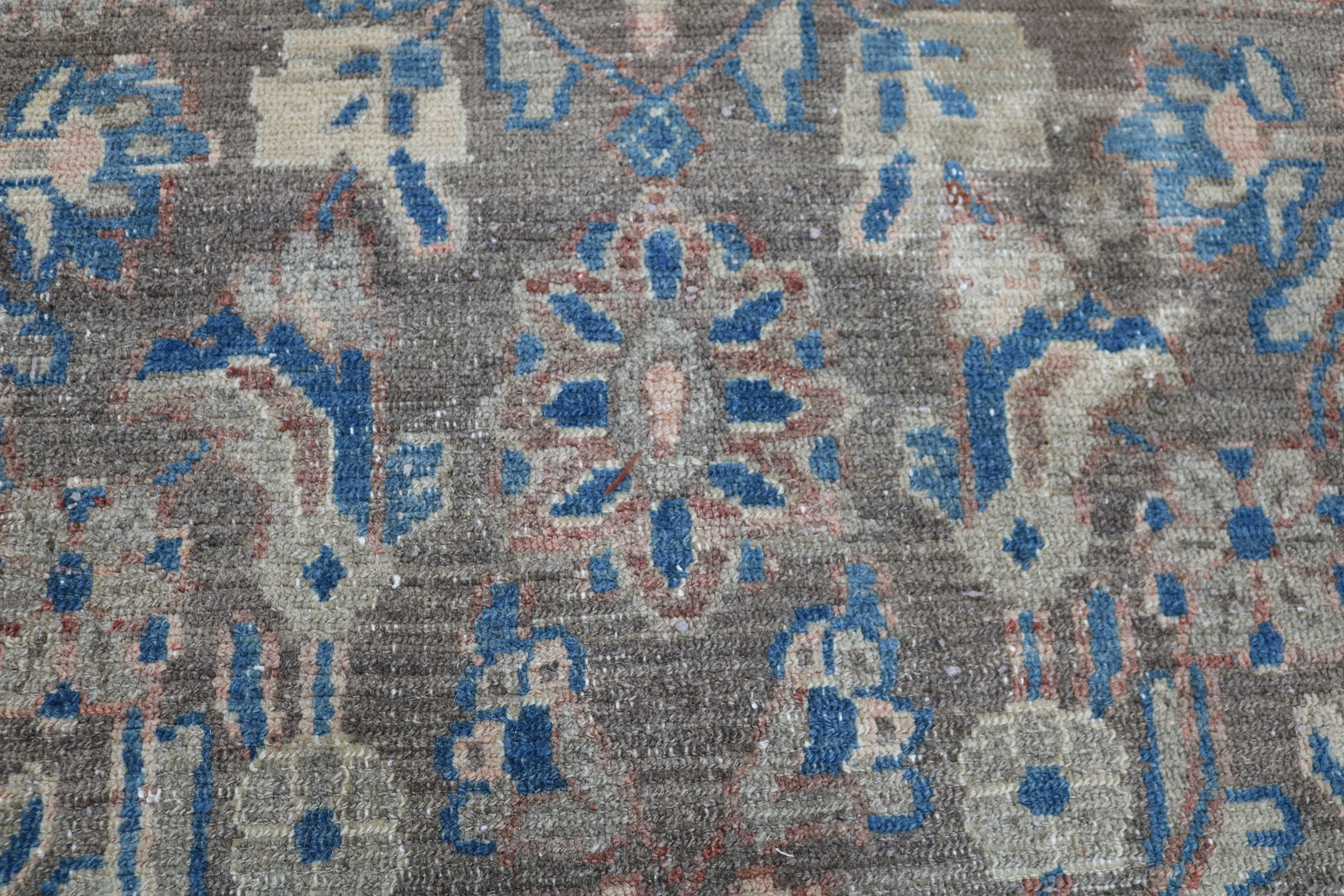 Close-up of hand-knotted wool texture on antique Persian Malayer rug