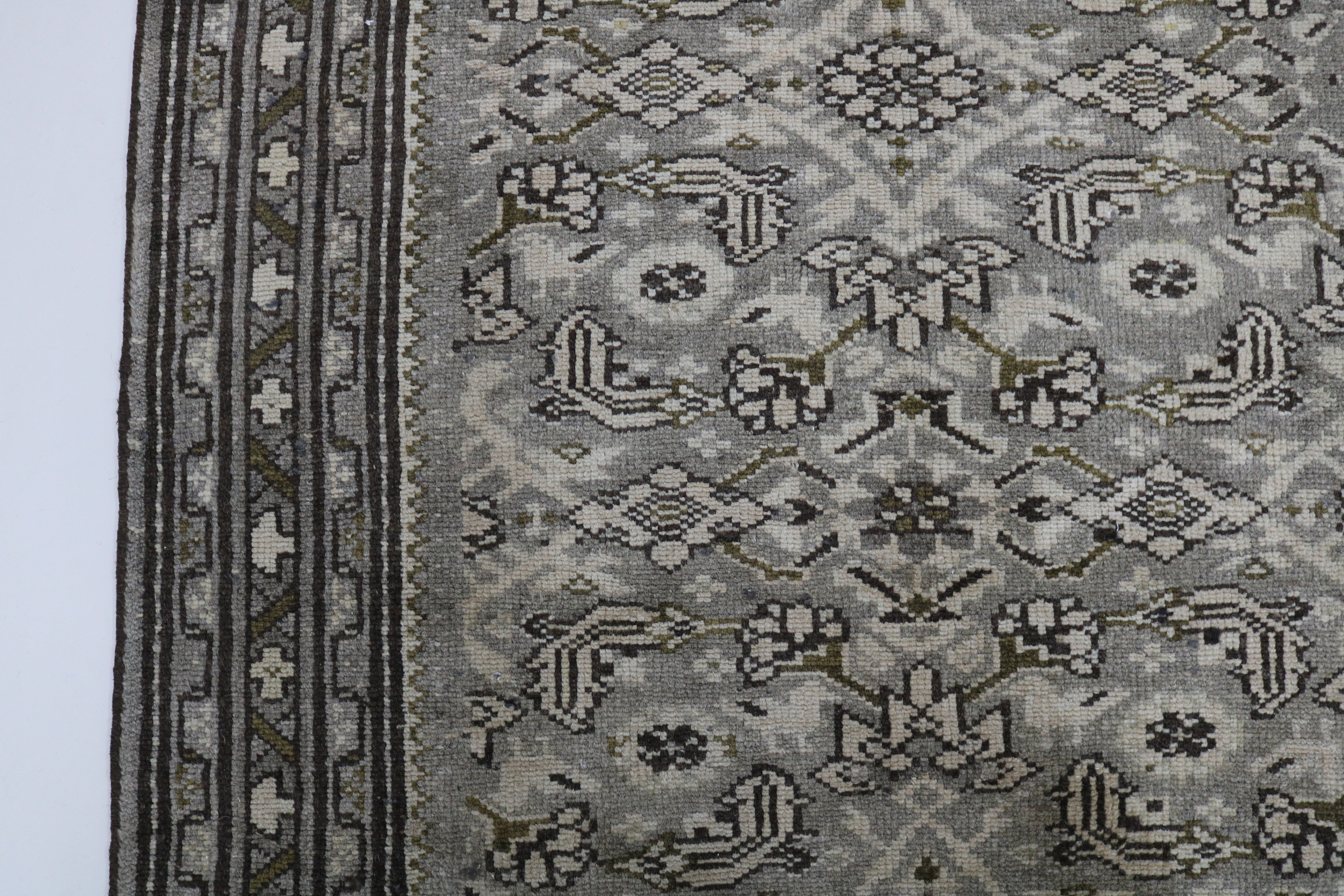 Close-up of hand-knotted wool texture on vintage Persian Malayer runner