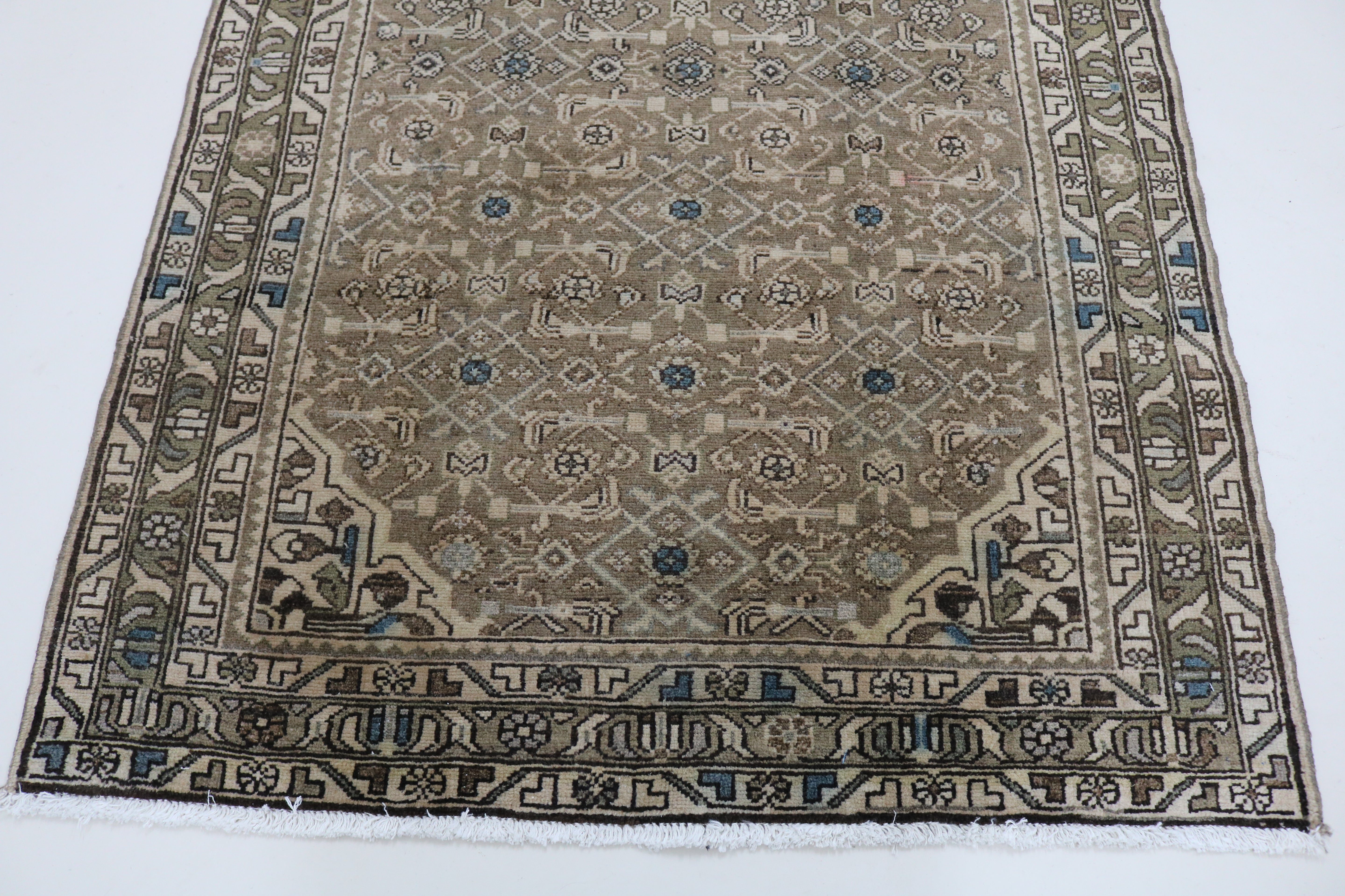 Close-up of hand-knotted wool texture on antique Persian Malayer runner