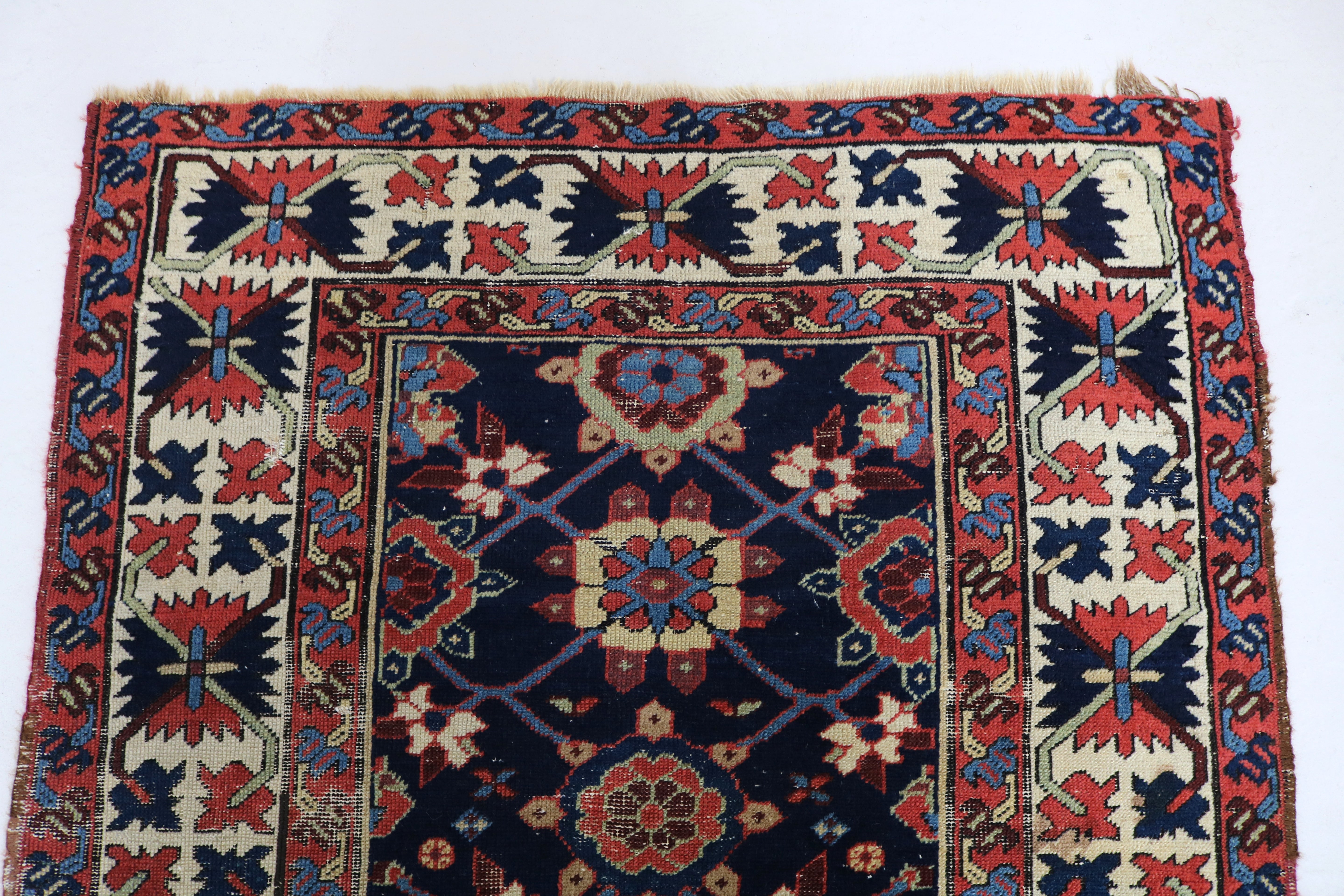 Close-up of hand-knotted wool texture on antique Caucasian Karabag runner