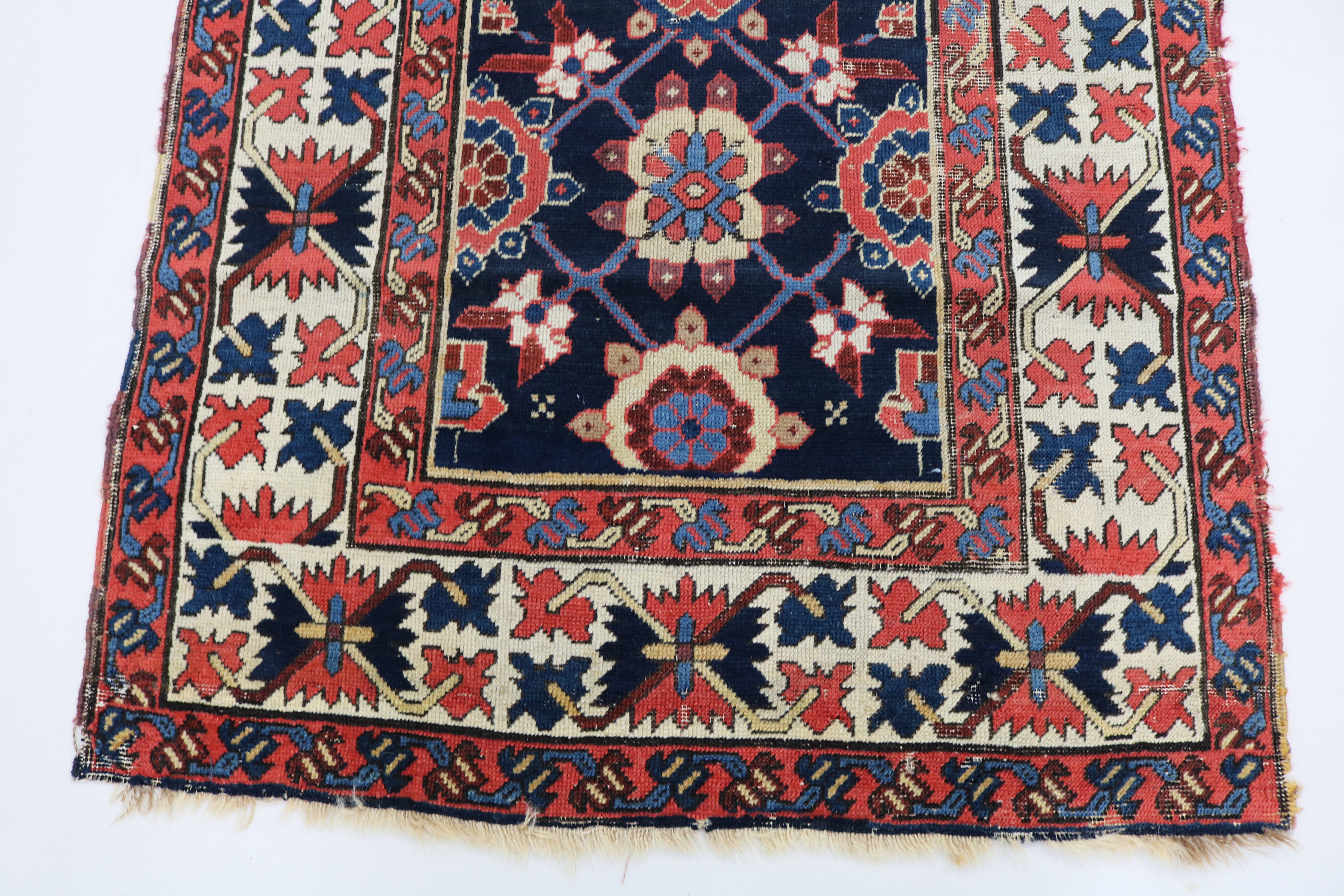 Close-up of hand-knotted wool texture on antique Caucasian Karabag runner