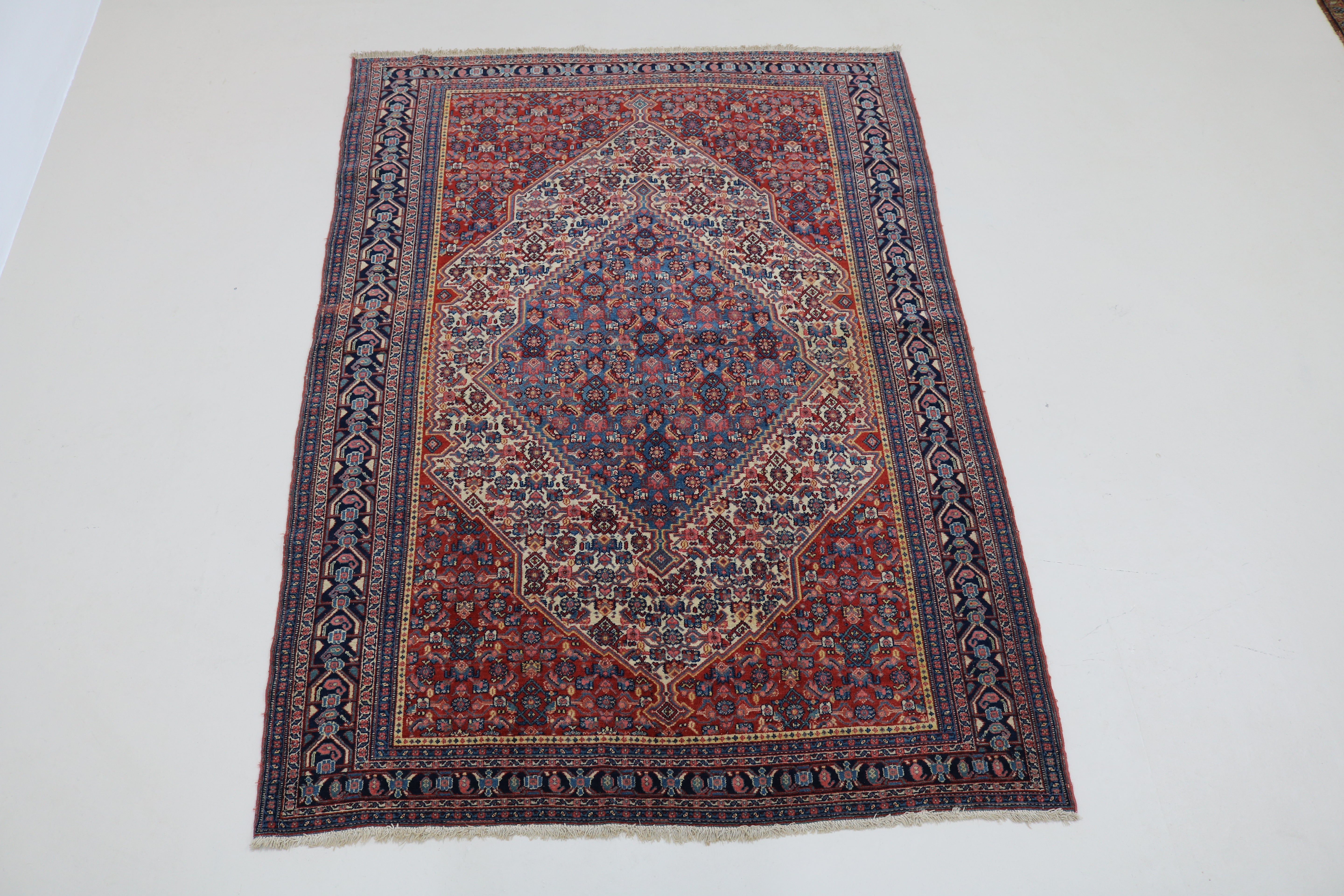 Full view of antique Persian Senneh rug with finely detailed all-over pattern