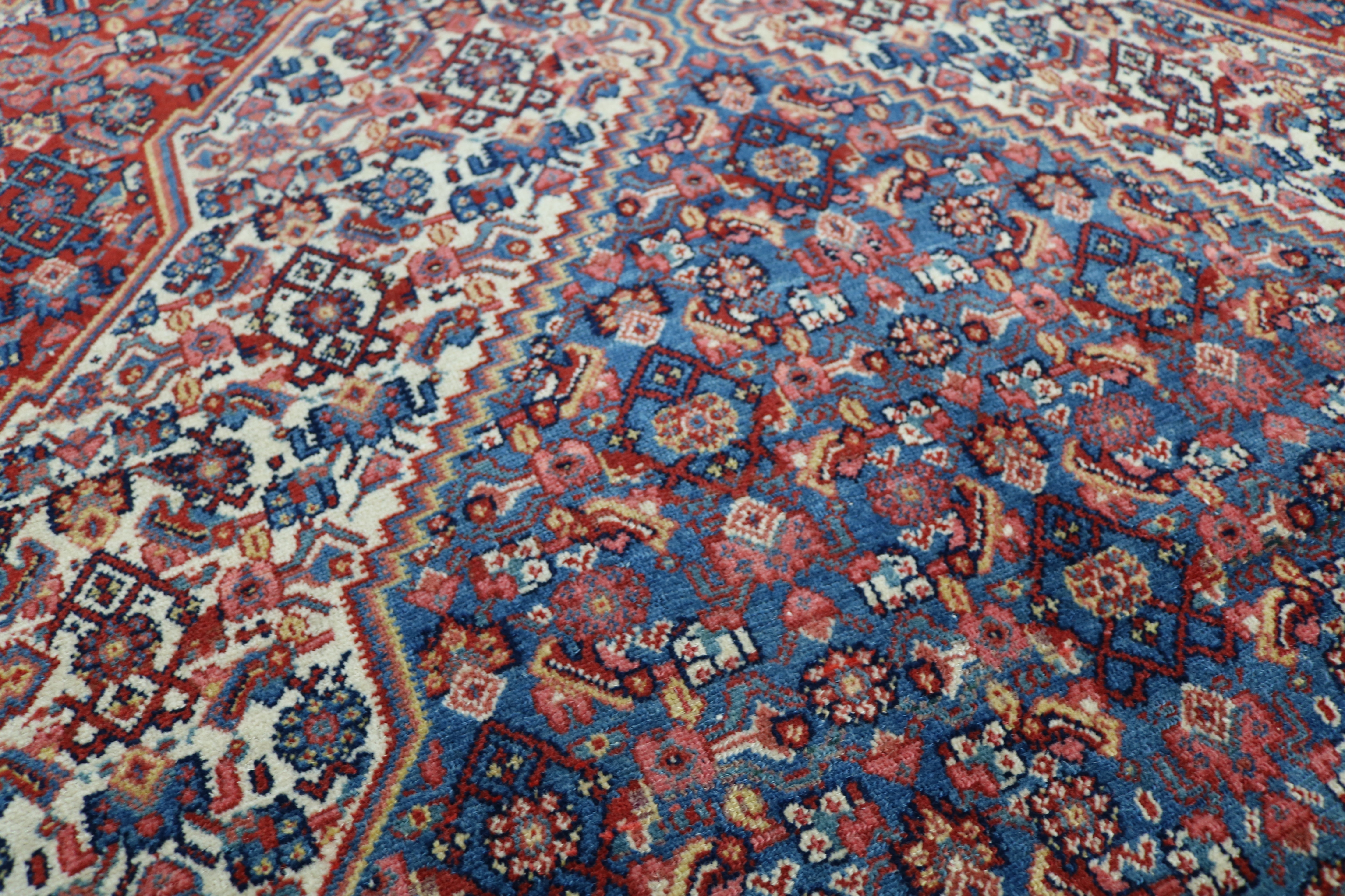 Close-up of finely woven wool texture on antique Persian Senneh rug