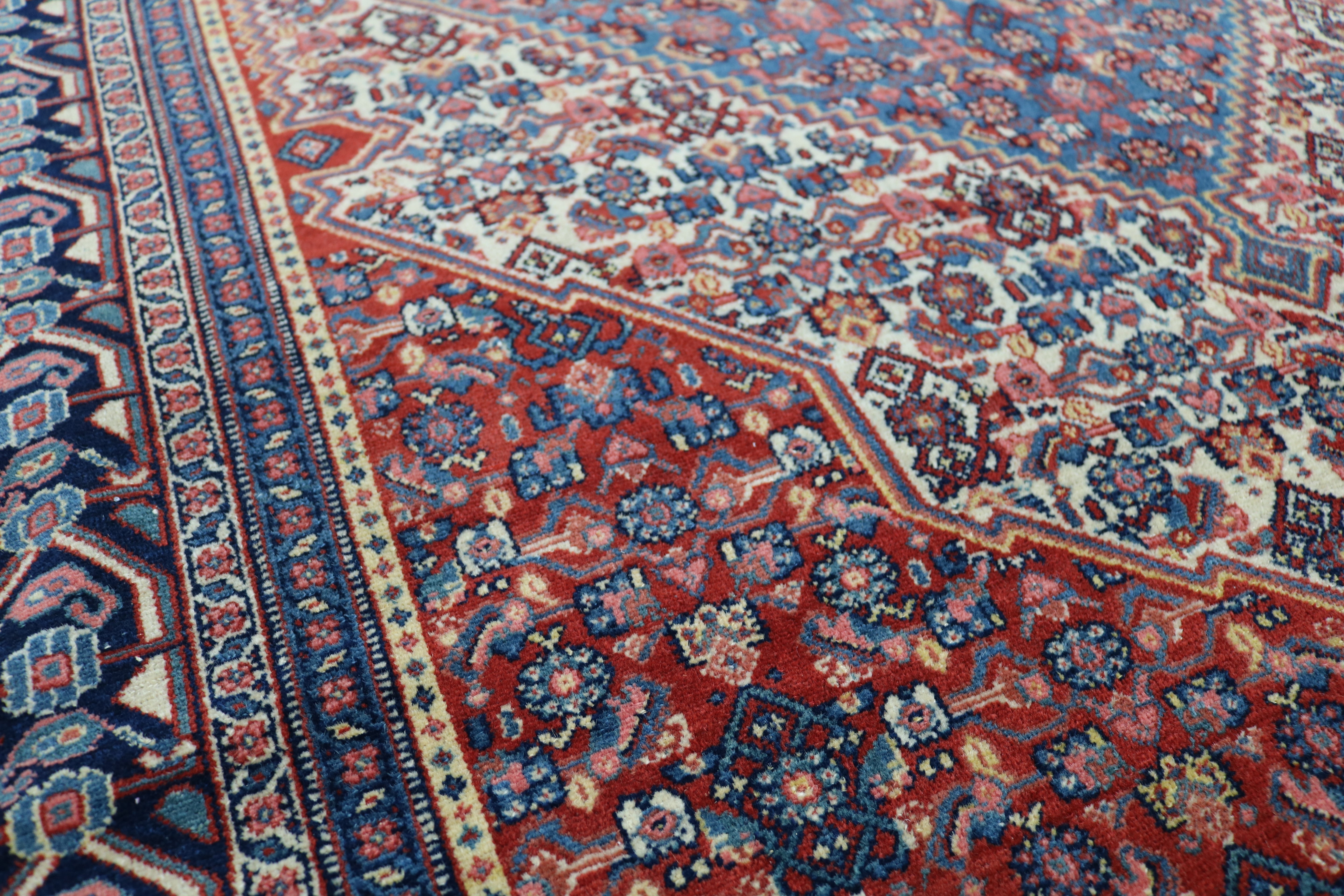 Close-up of finely woven wool texture on antique Persian Senneh rug