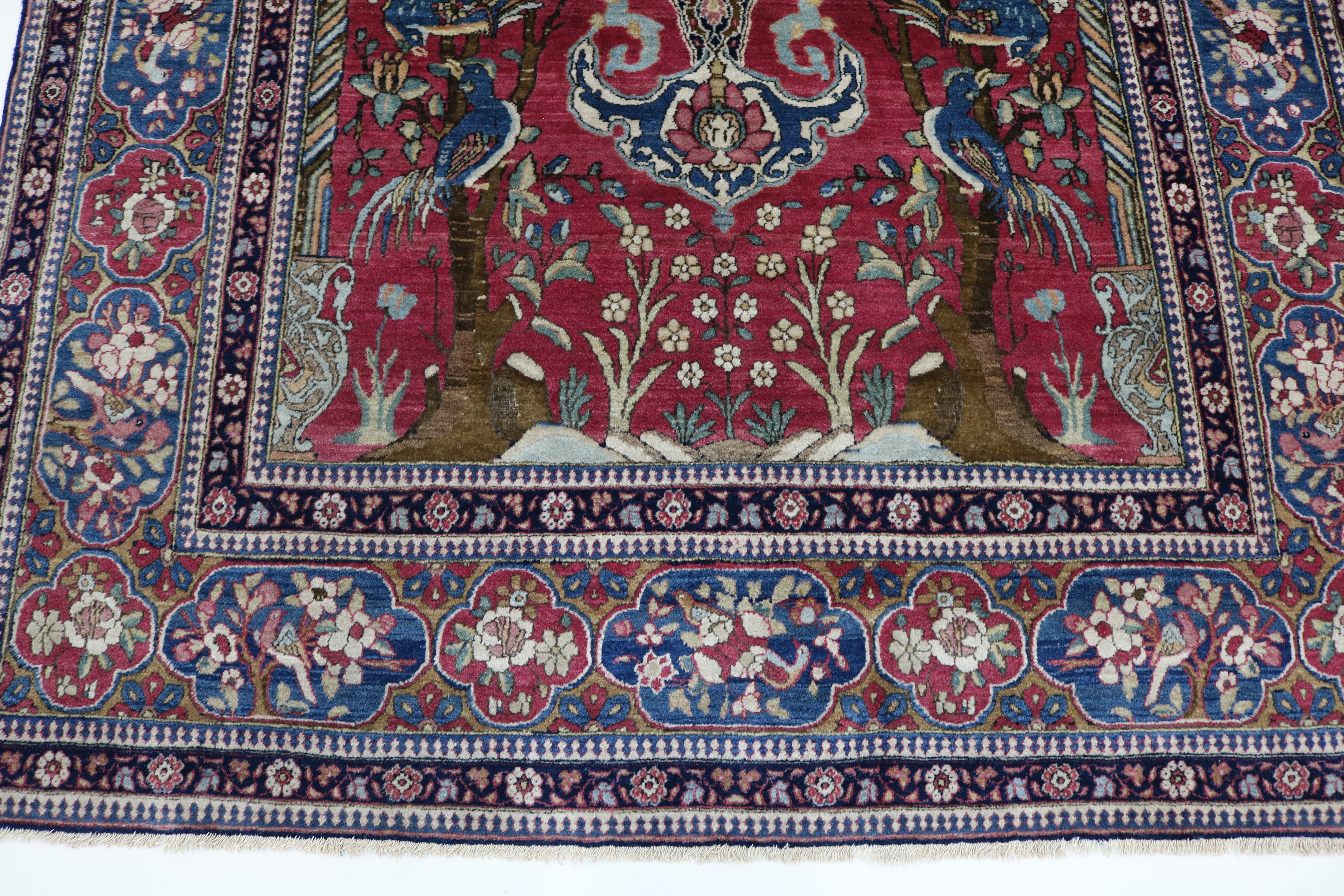 Close-up of finely knotted wool texture on antique Isfahan rug