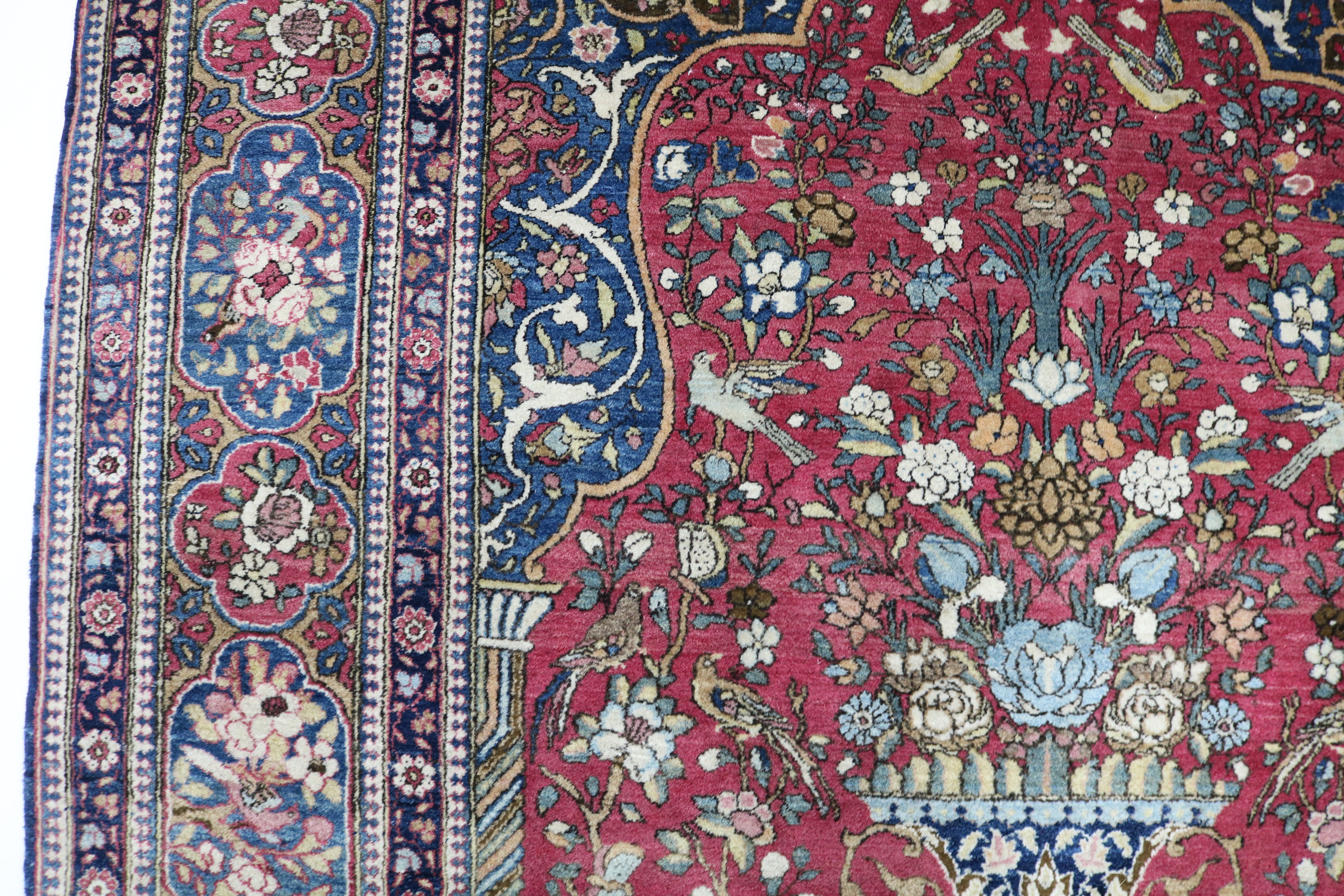 Close-up of finely knotted wool texture on antique Isfahan rug