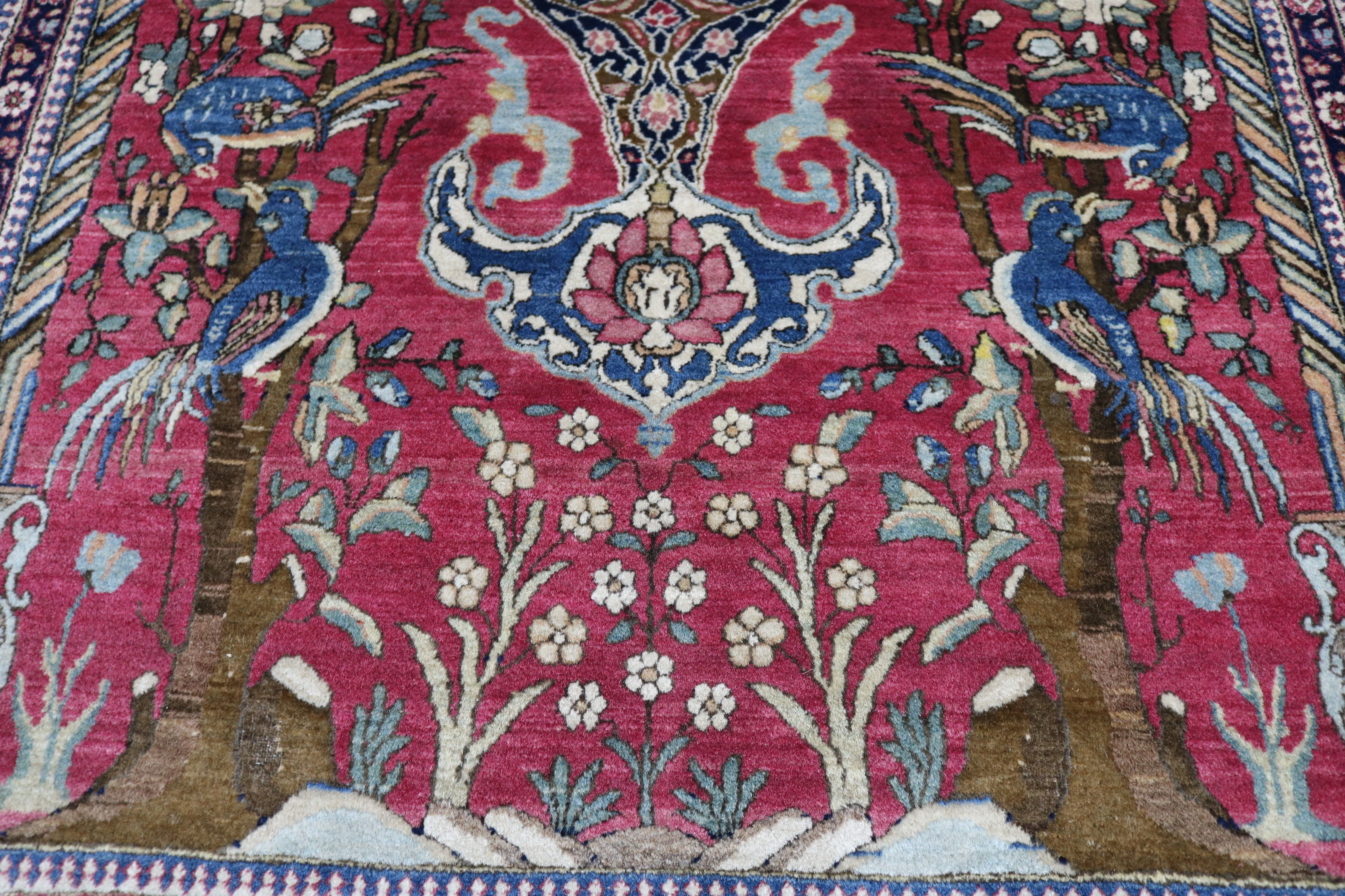 Close-up of finely knotted wool texture on antique Isfahan rug