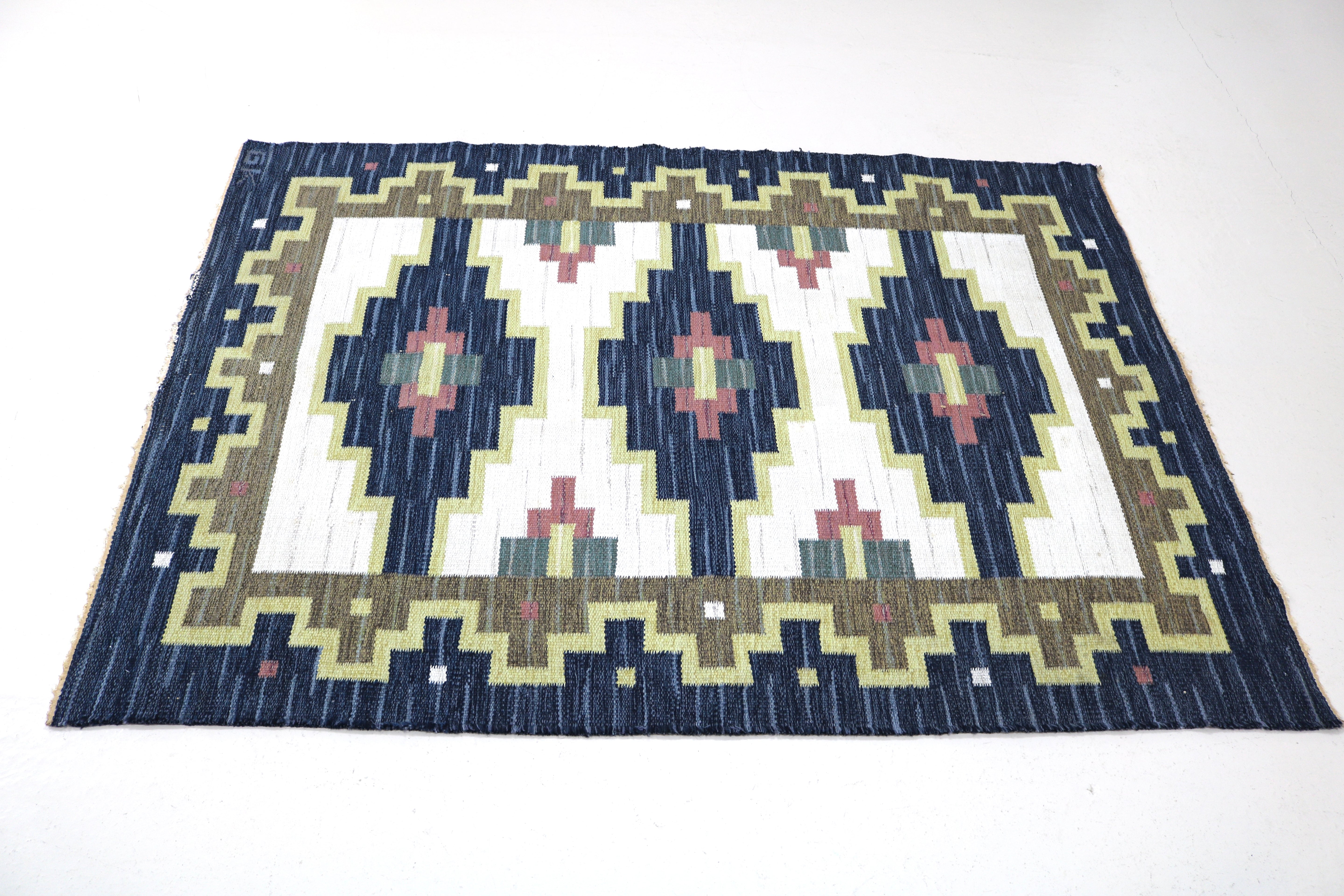 Close-up of geometric woven pattern on a vintage Swedish wool rug.