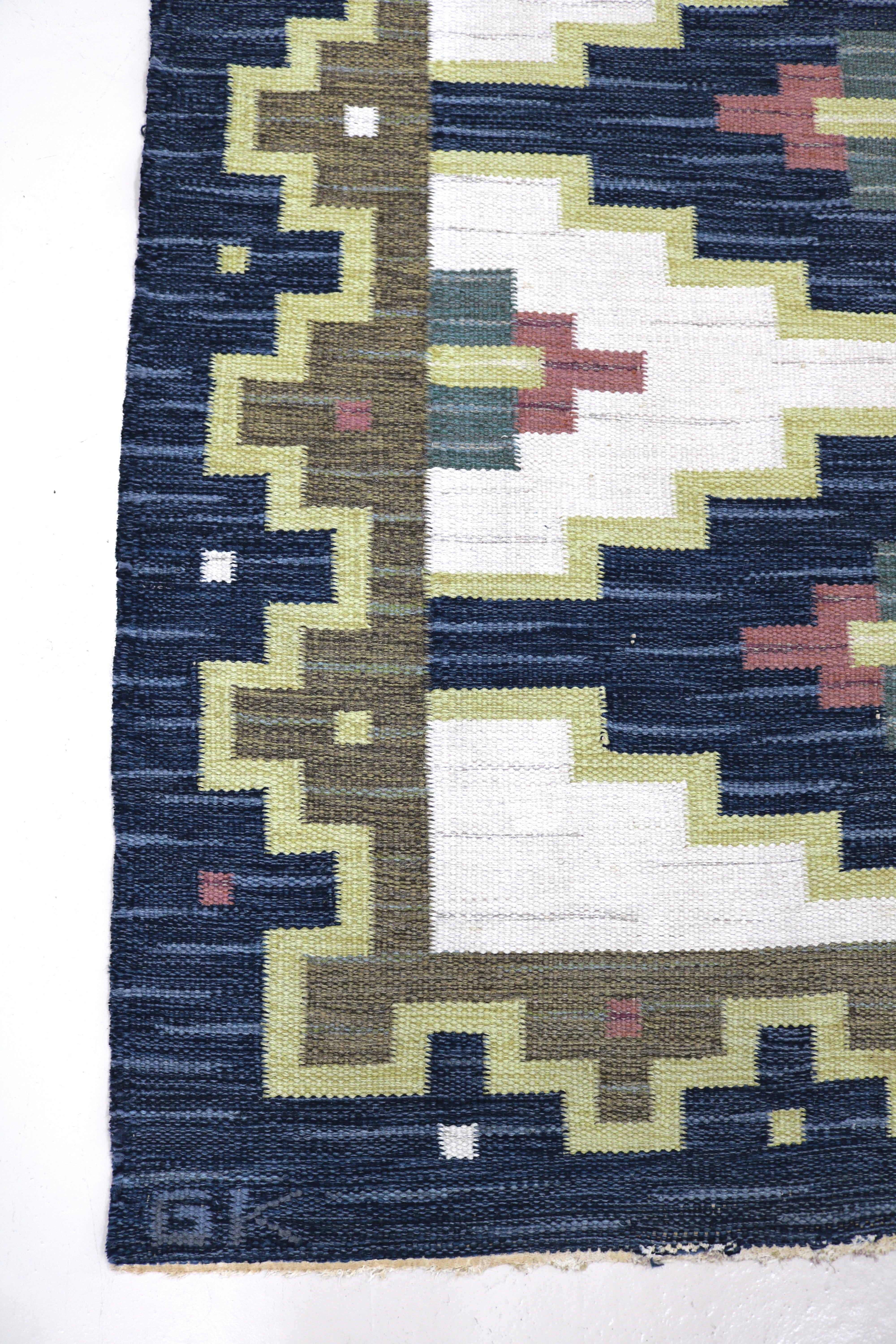 Vintage Swedish kilim rug 202 × 143 cm with navy blue, ivory and olive geometric motifs.