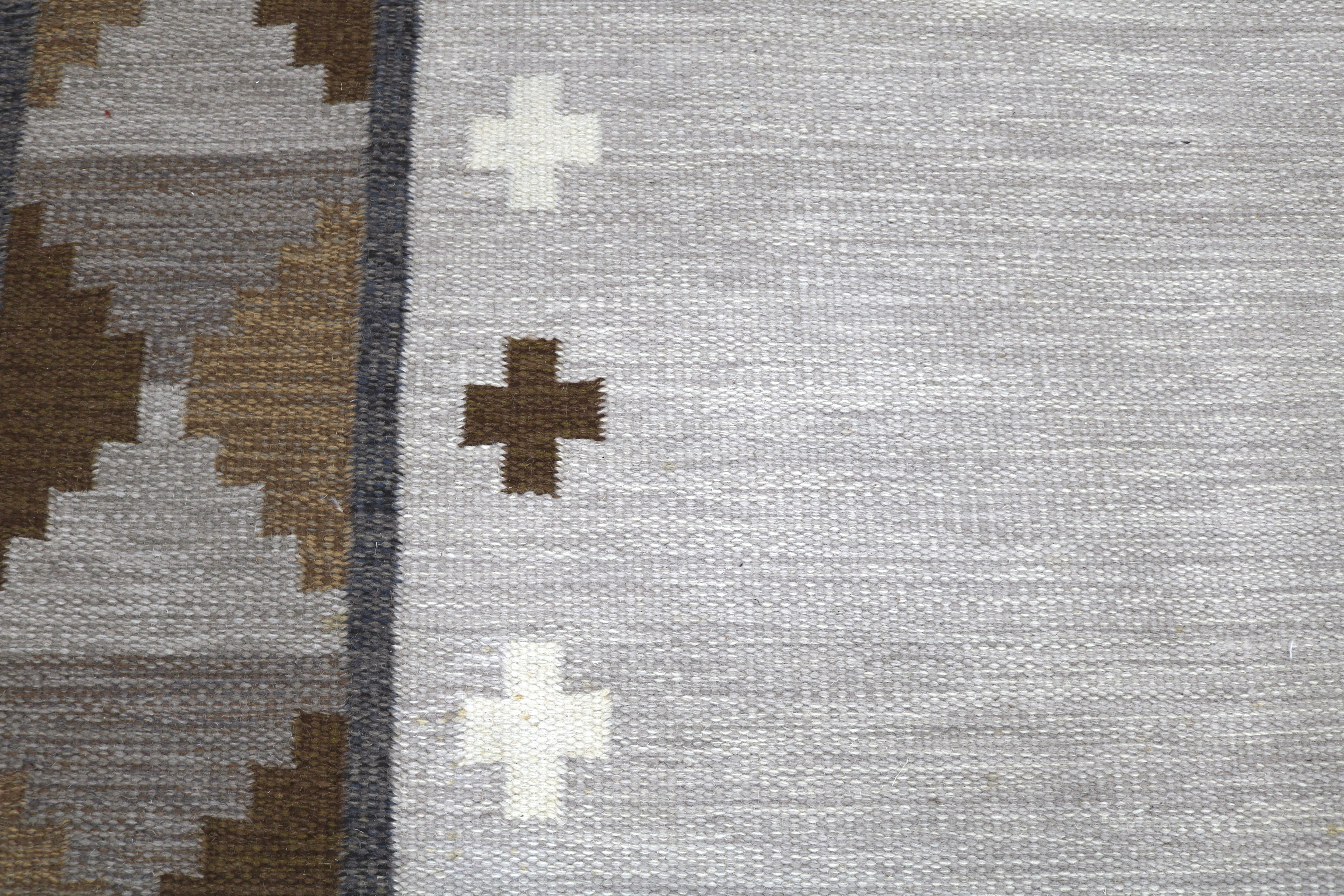 Close-up showing the fine wool texture and craftsmanship of a vintage Swedish rug.