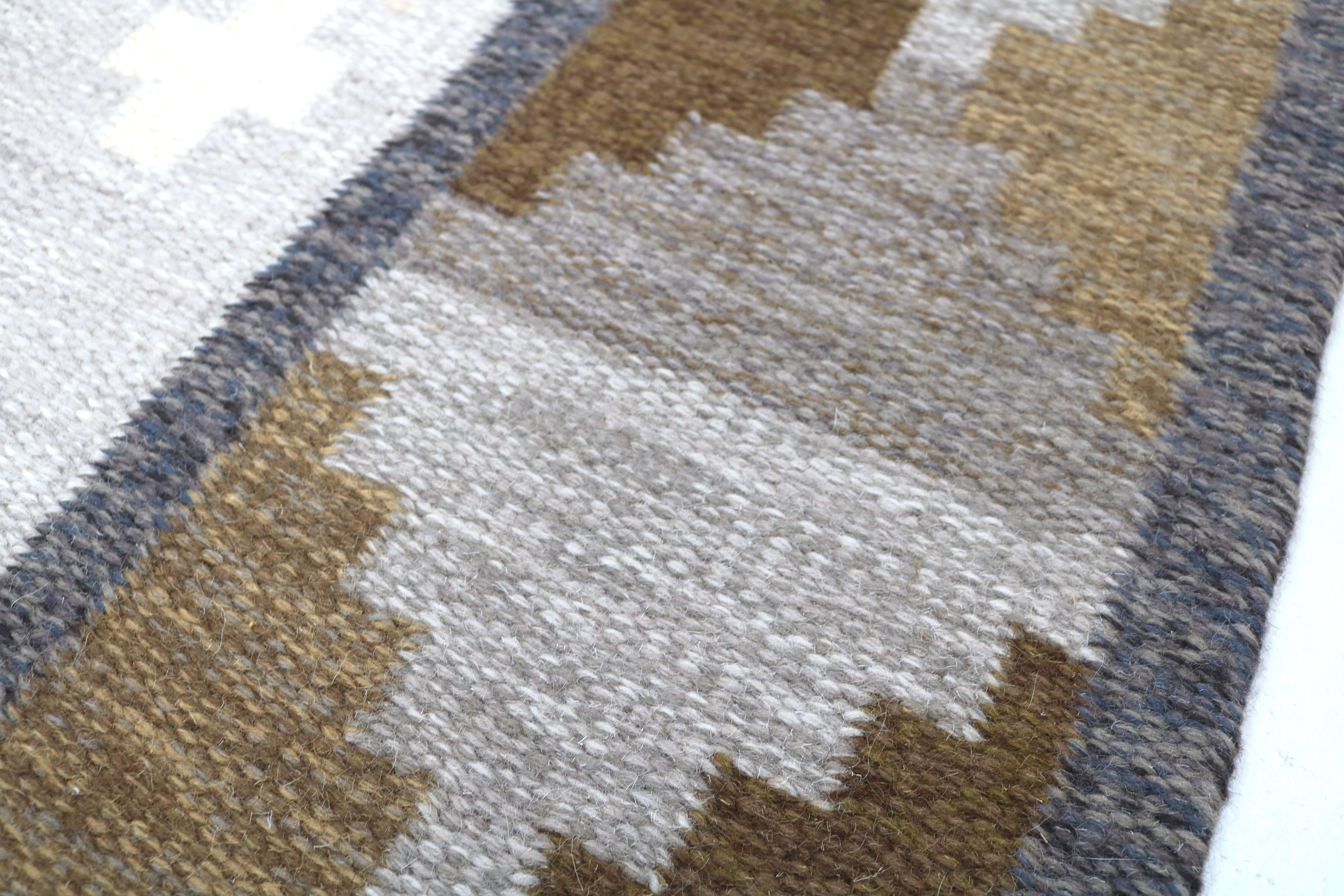 Detailed view of the woven border on an authentic vintage Swedish flatweave rug.
