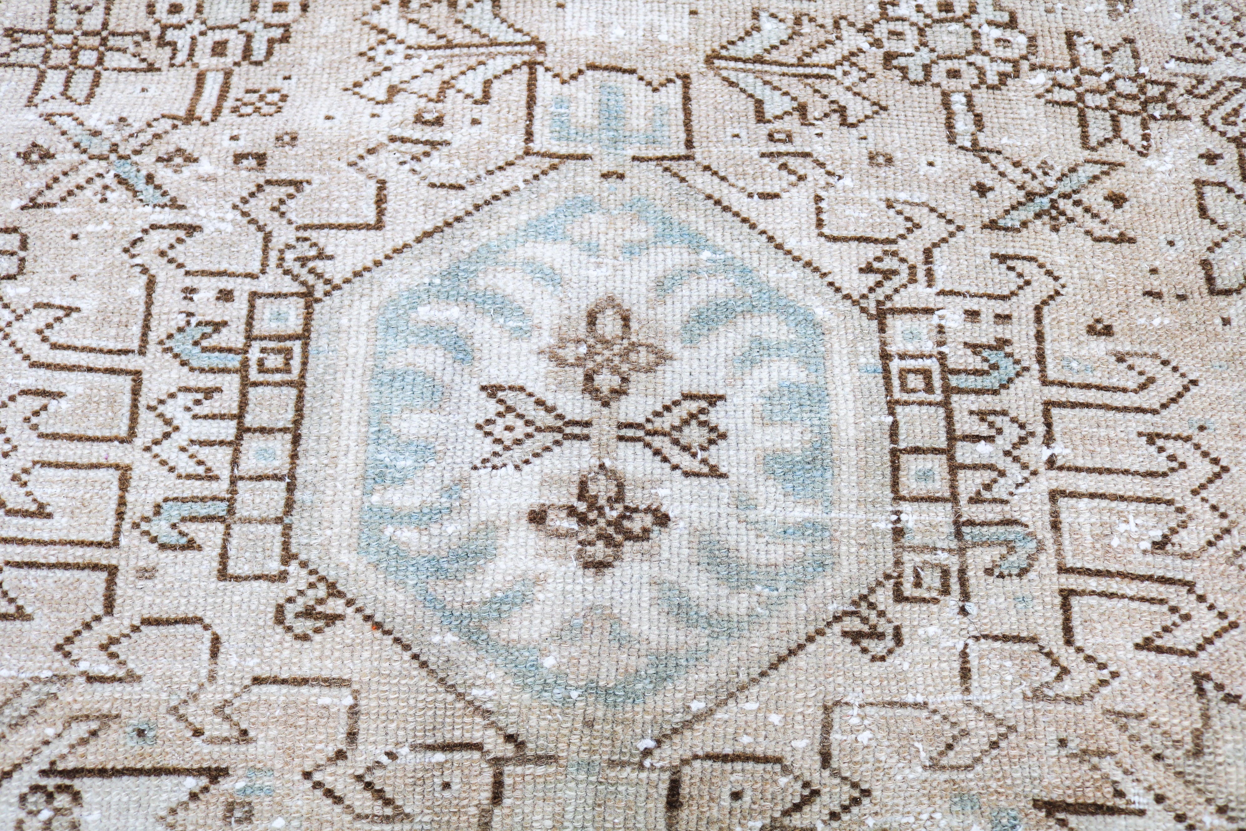 Handwoven Persian Heriz-Karaja rug detail with refined geometric drawing and authentic aged character