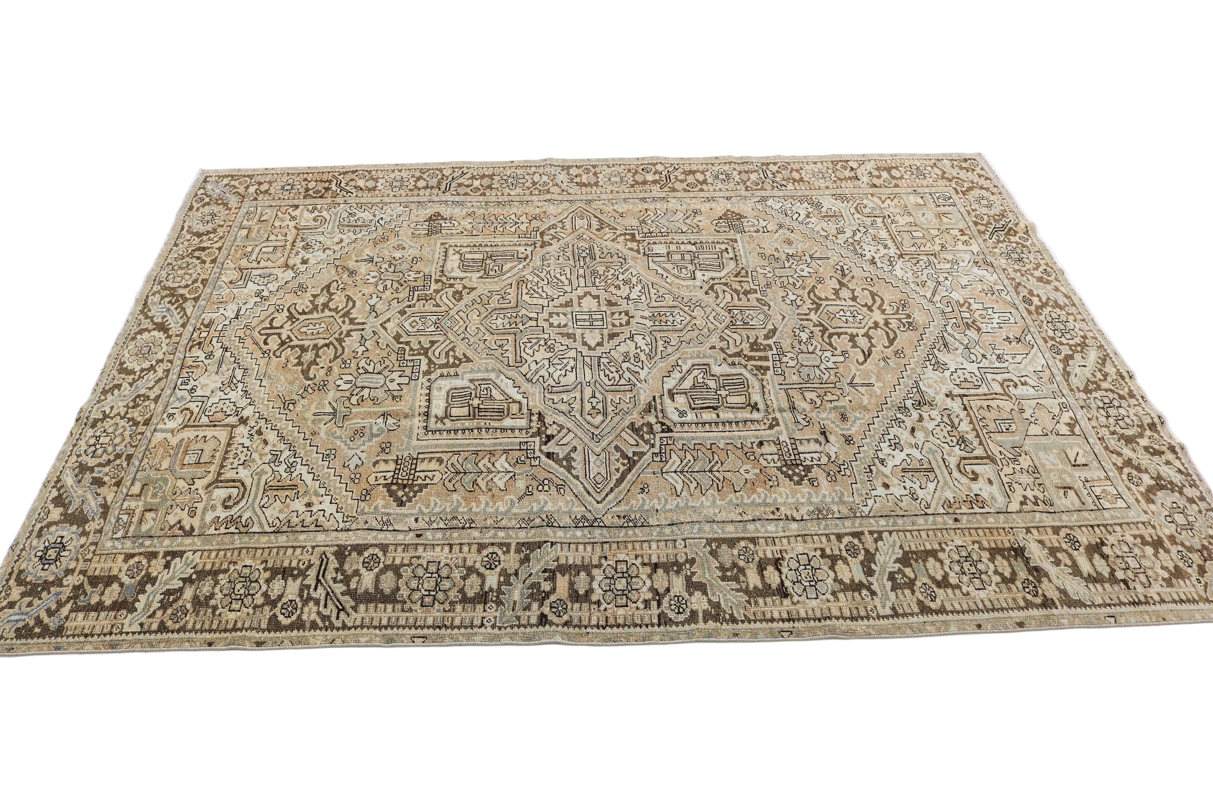 Oversized antique Persian Heriz carpet circa 1930 displayed with traditional geometric pattern