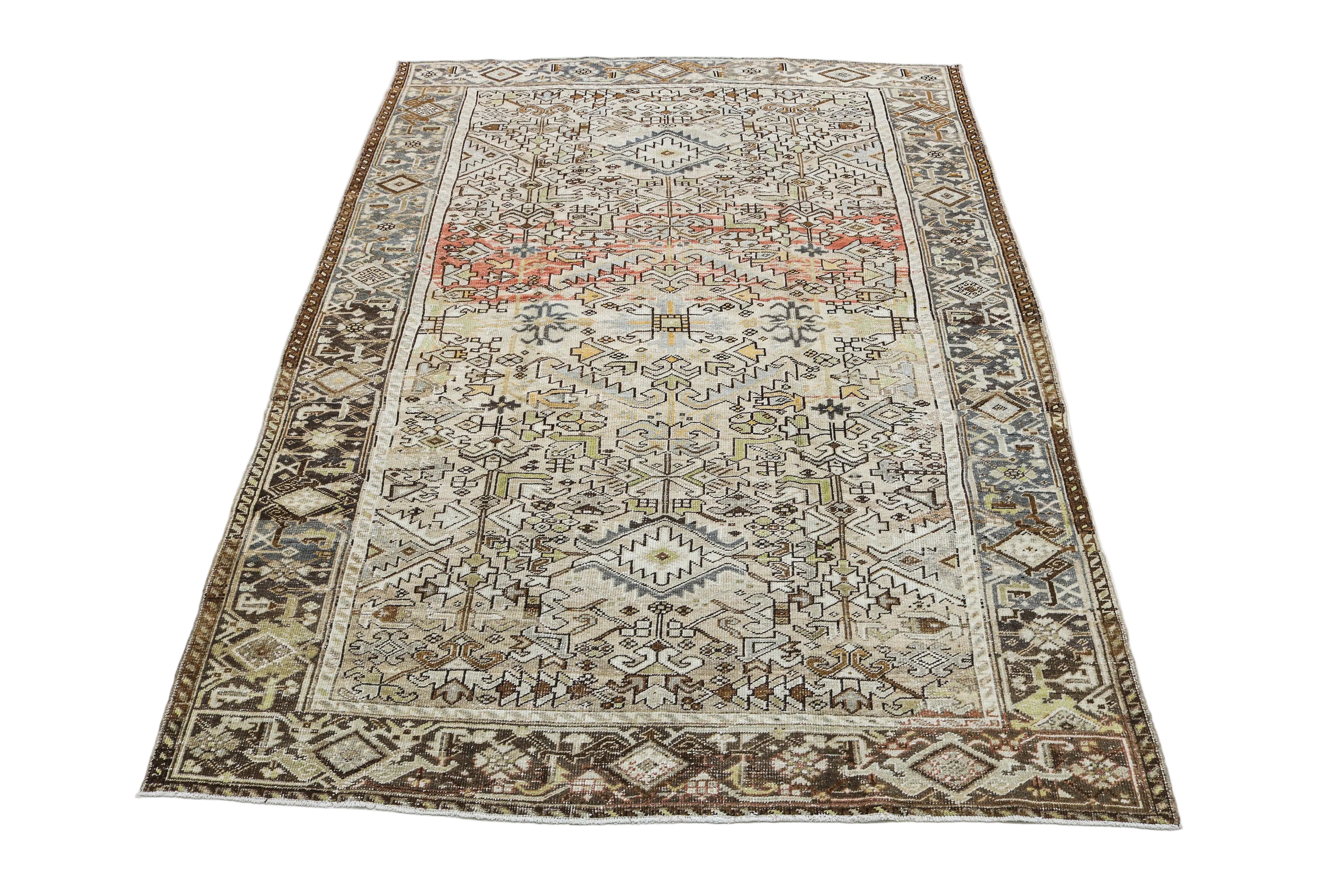 Large antique Persian Heriz carpet with intricate geometric motifs in ivory and muted brown tones