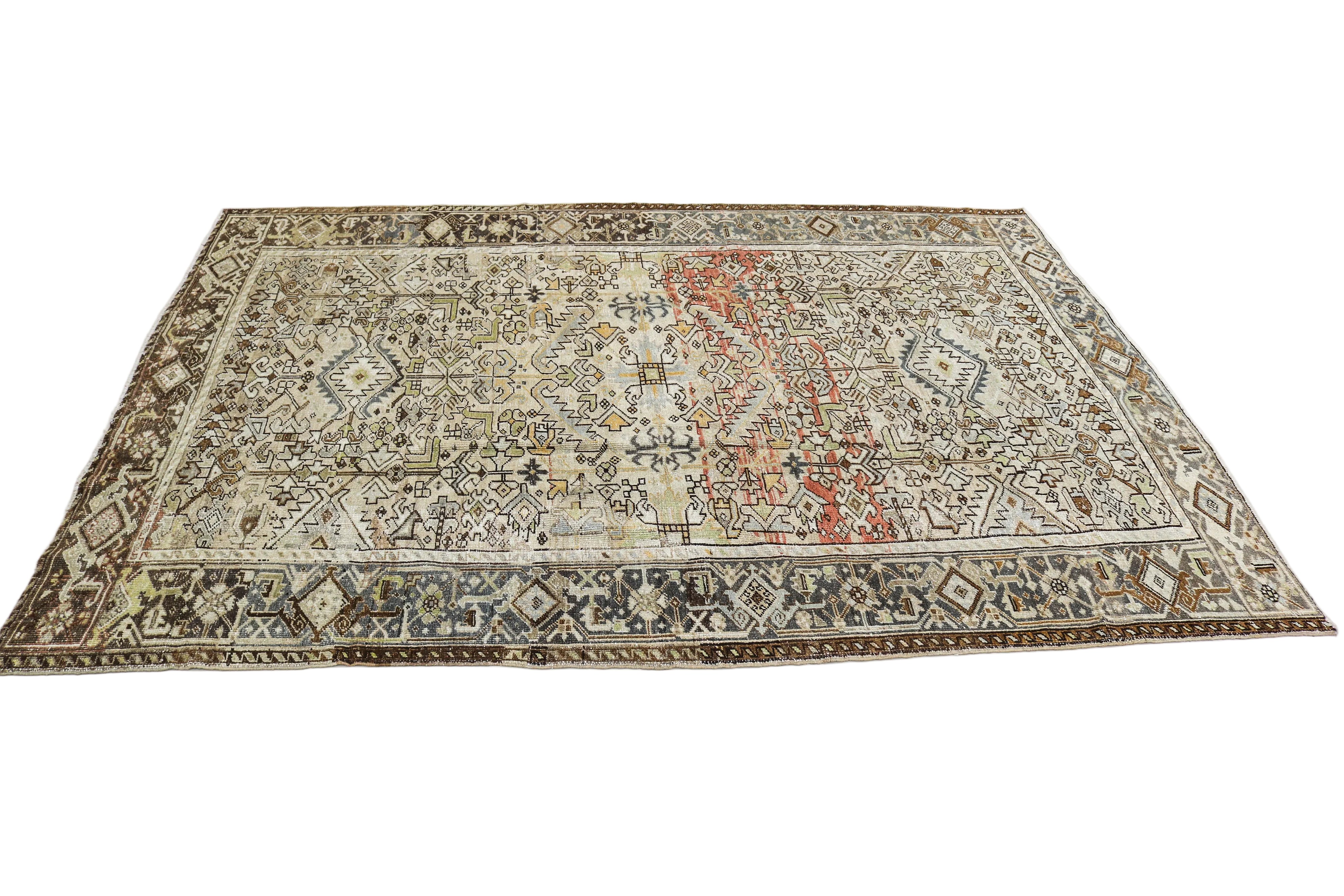 Oversized antique Persian Heriz carpet circa 1930 displayed with traditional geometric design