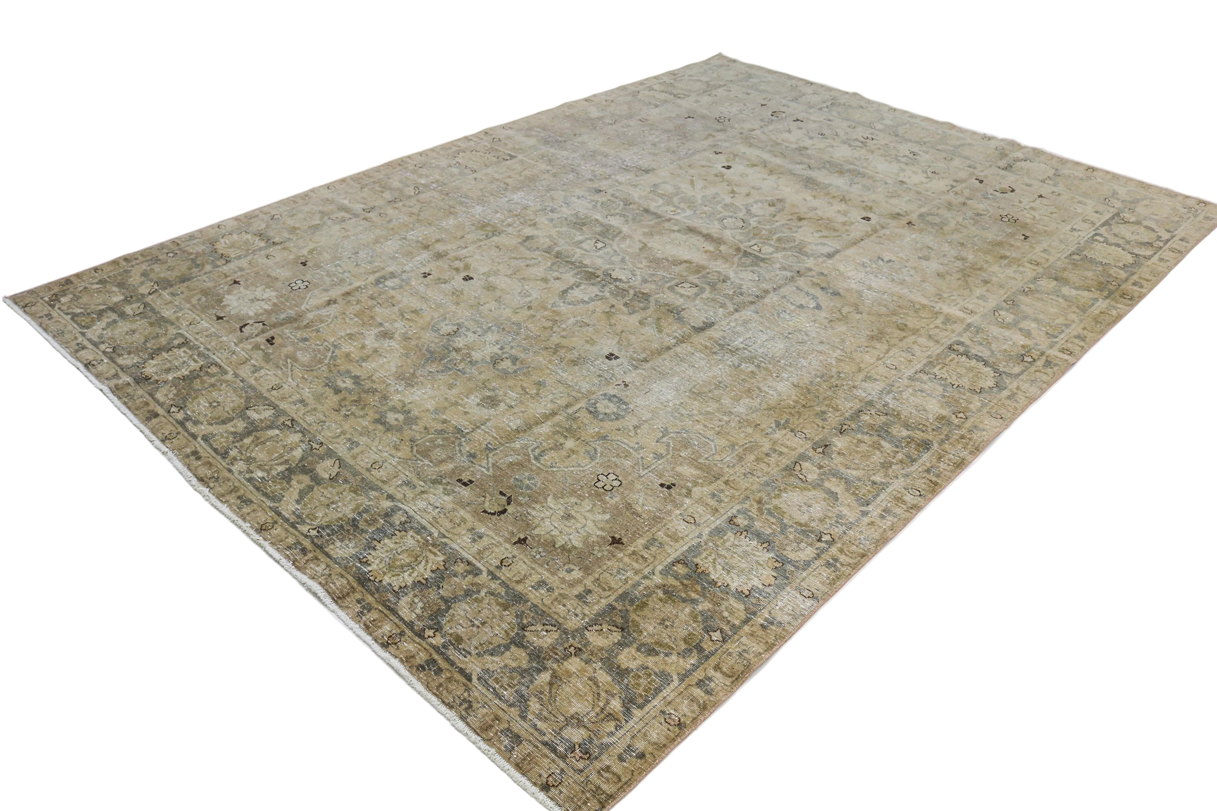Hand-knotted antique Persian Tabriz rug with refined floral motifs and naturally faded colours