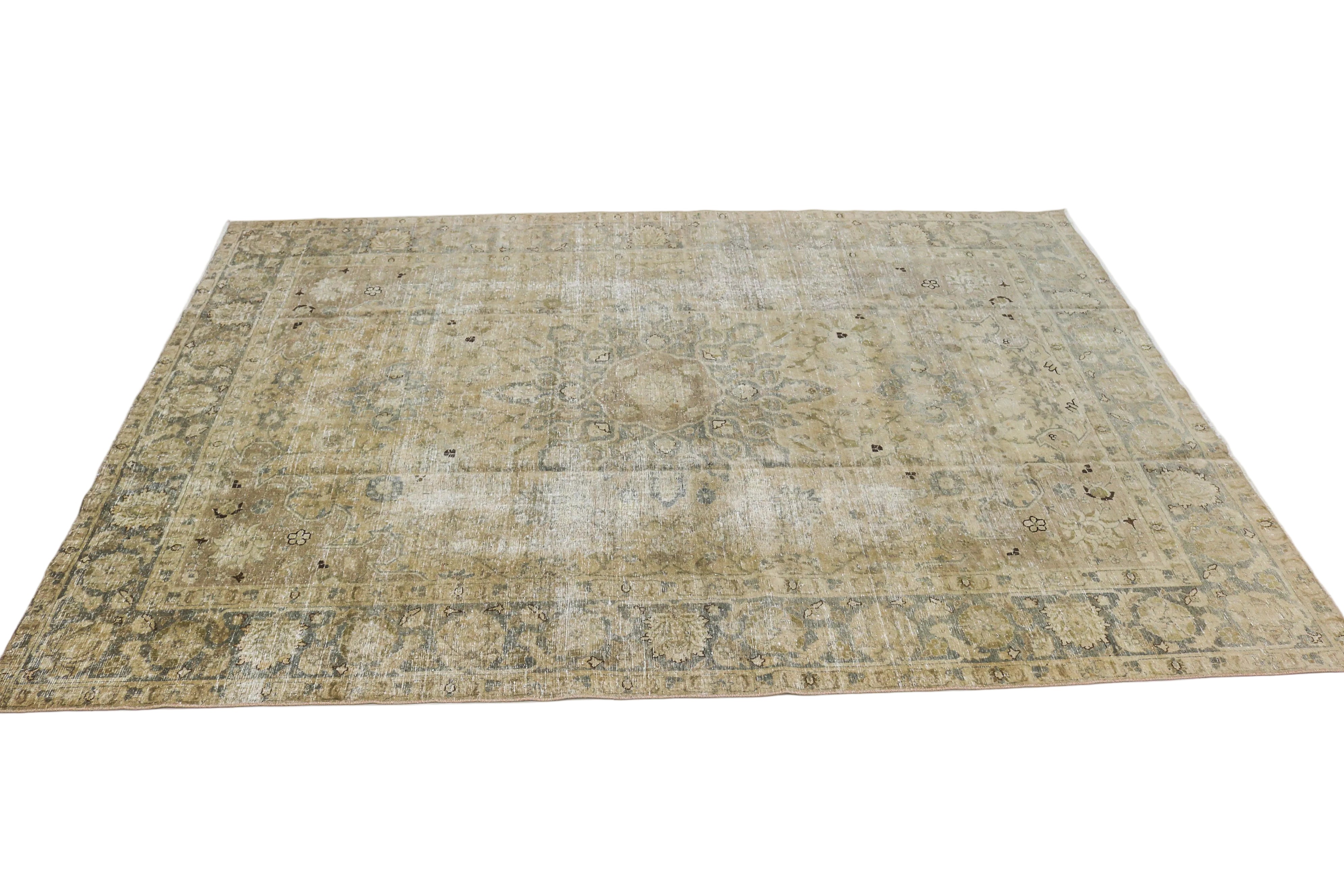 Oversized antique Persian Tabriz carpet circa 1930 displayed with traditional floral pattern