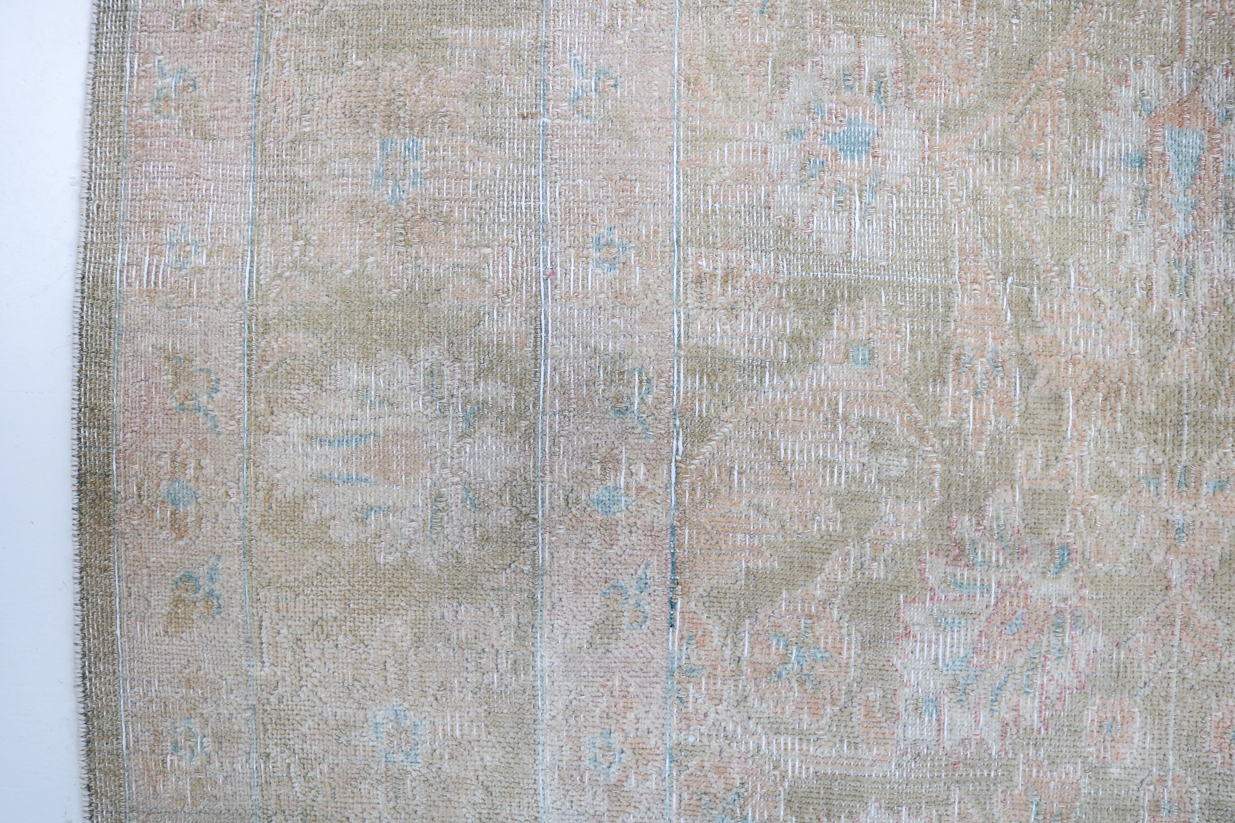 Handwoven Persian Sarouk rug detail with refined craftsmanship and naturally aged character