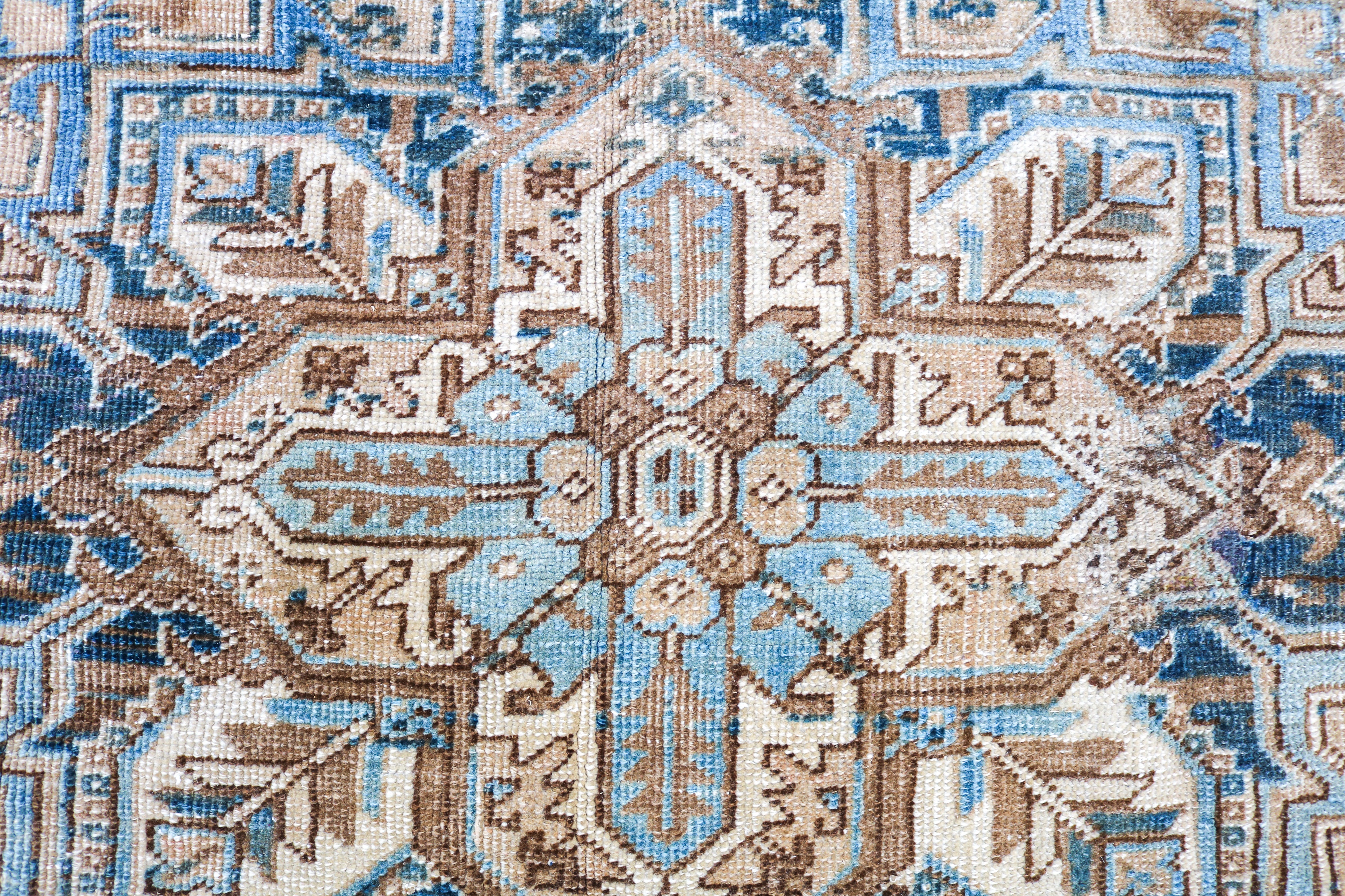 Handwoven Persian Heriz rug detail with refined tribal drawing and naturally aged character