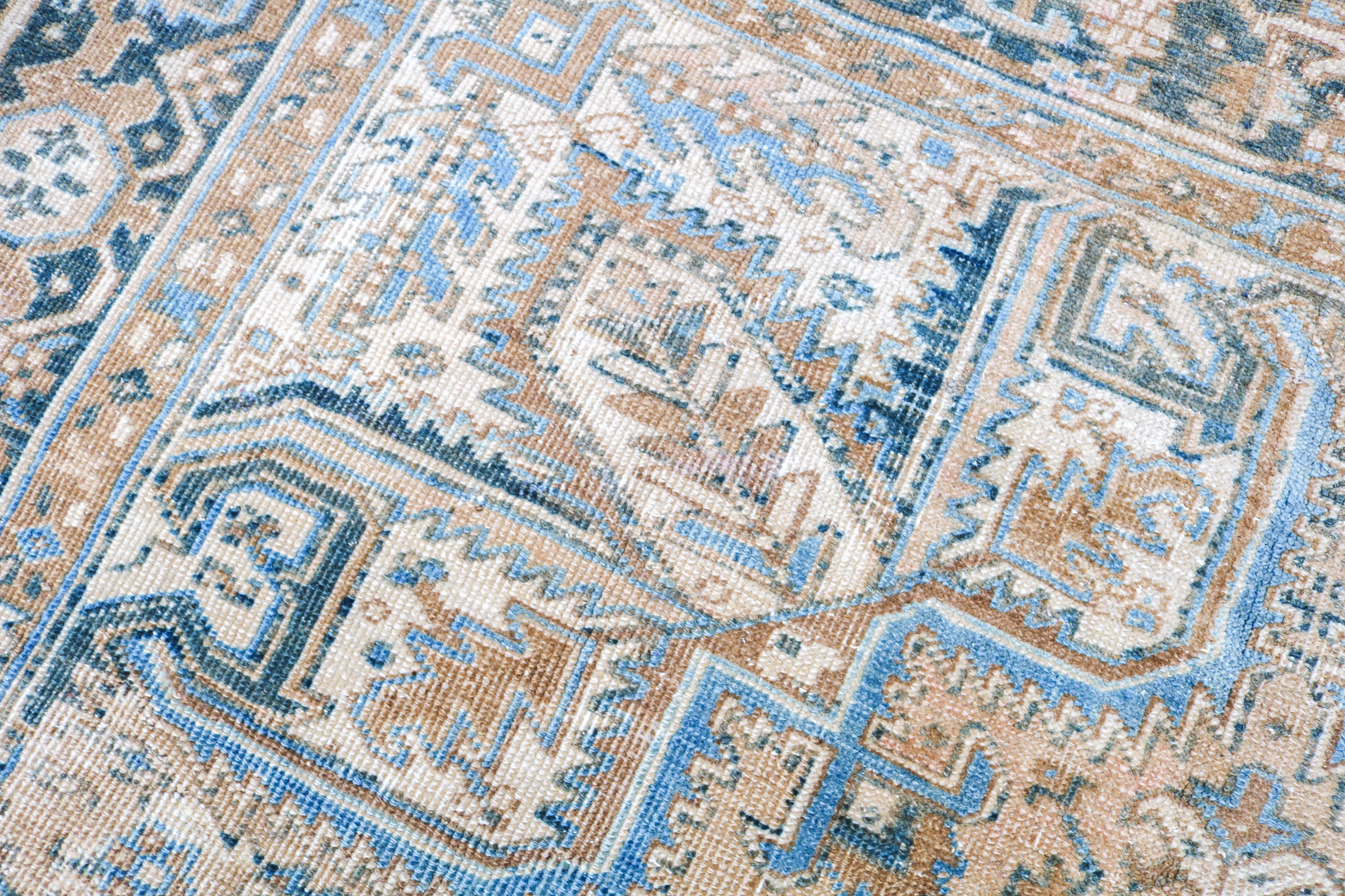 Antique Persian rug close-up showing fine geometric weaving and subtle natural colour variation